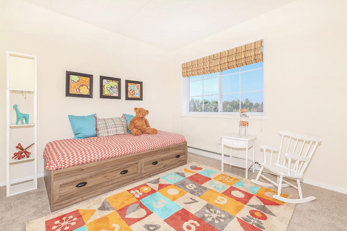 a bedroom with a red and white furniture