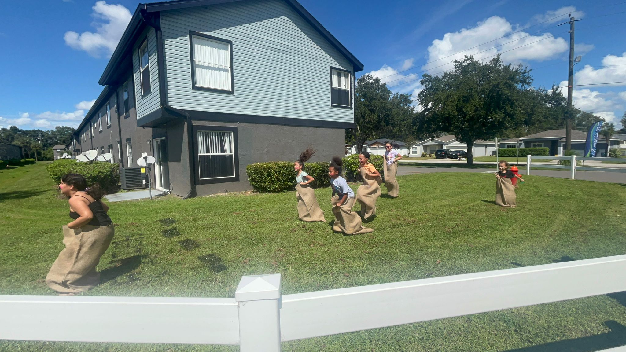 a group of people standing in a yard