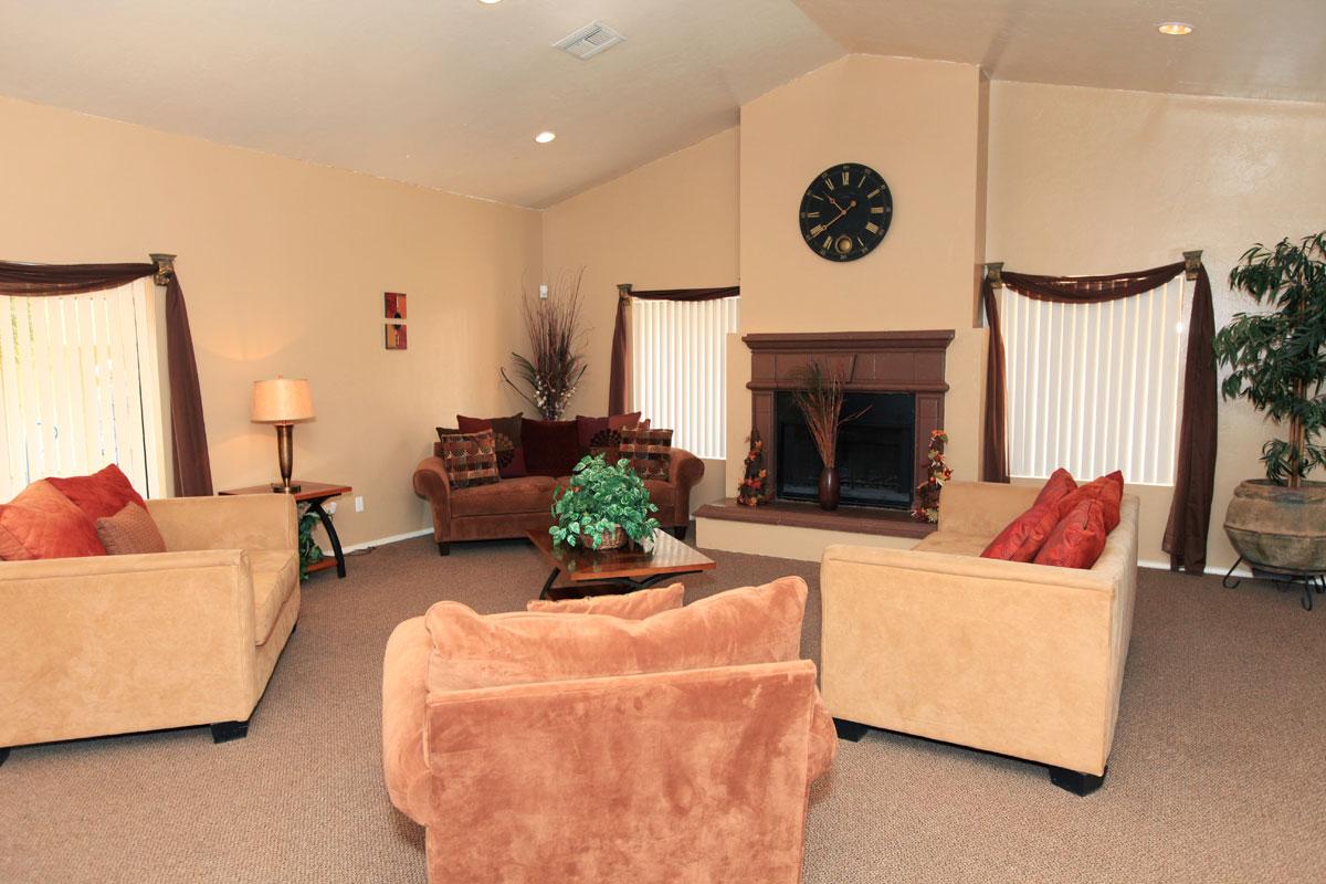 a living room filled with furniture and a flat screen tv