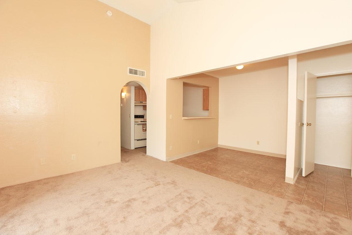 a bedroom with a wooden floor