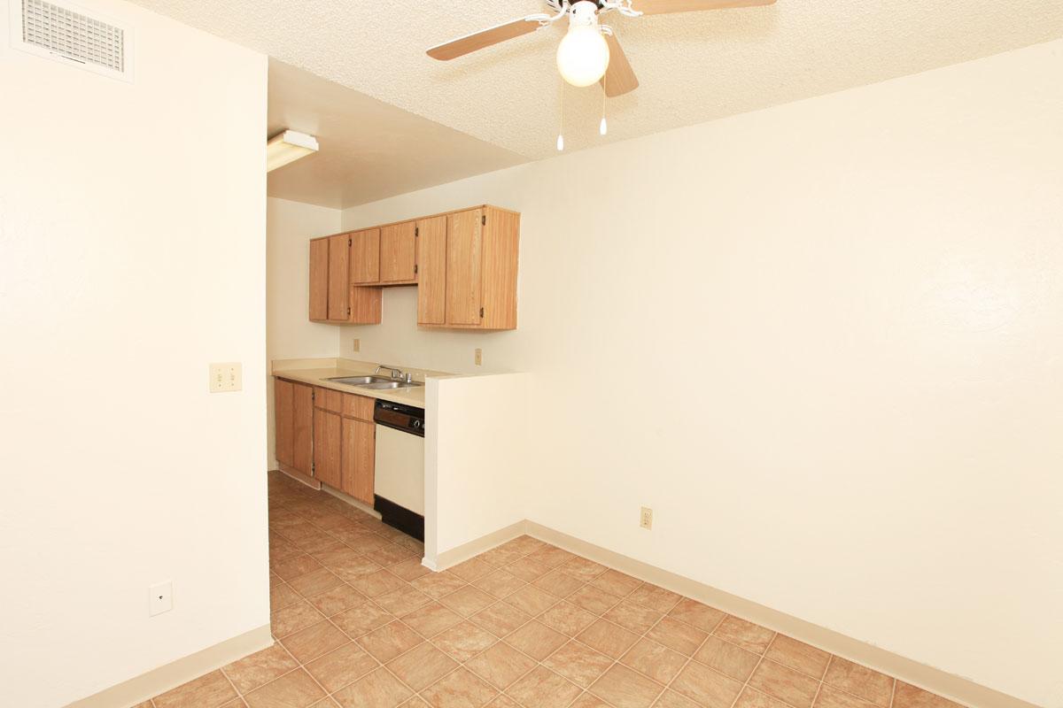a white refrigerator freezer sitting inside of a kitchen
