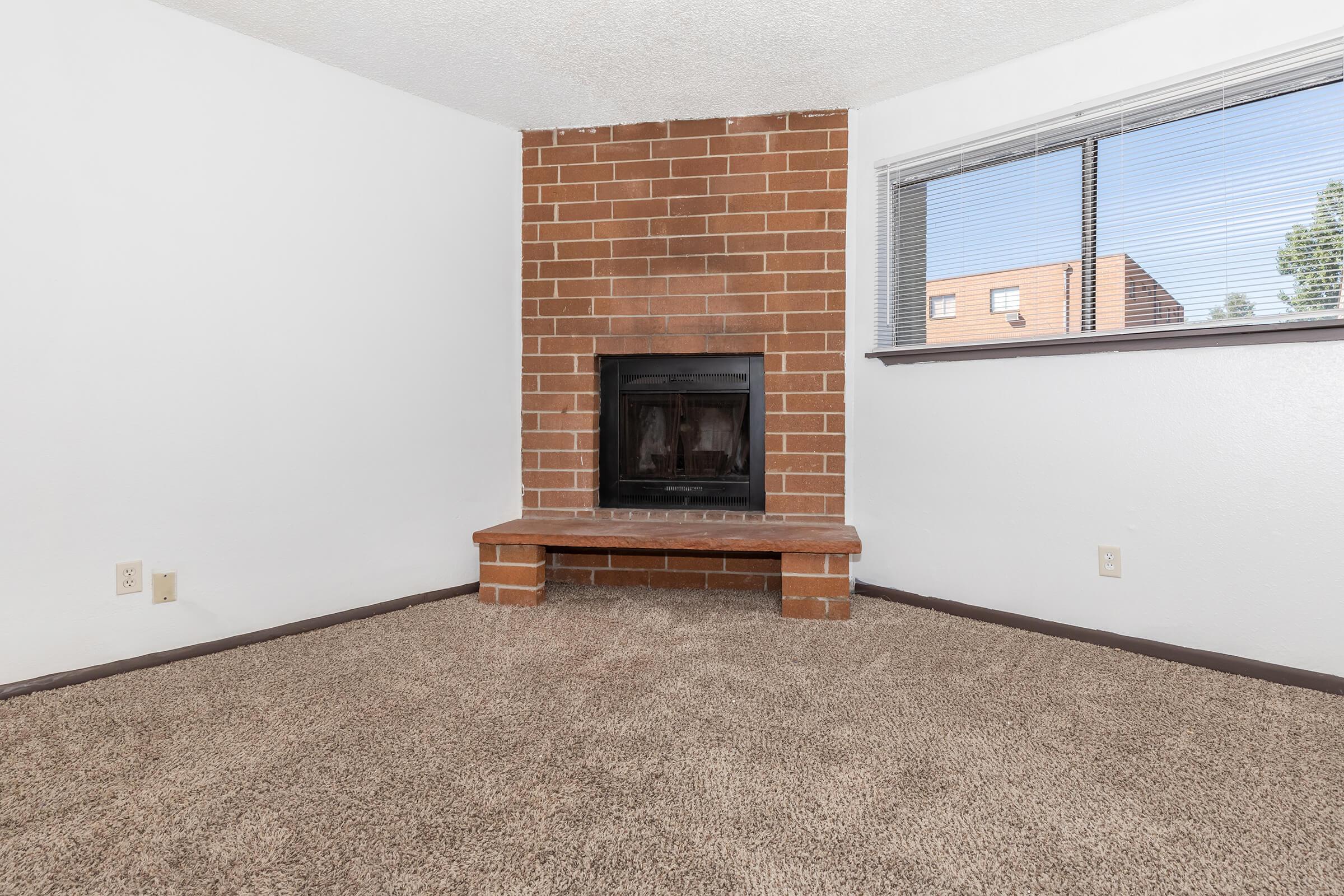 a living room with a fireplace