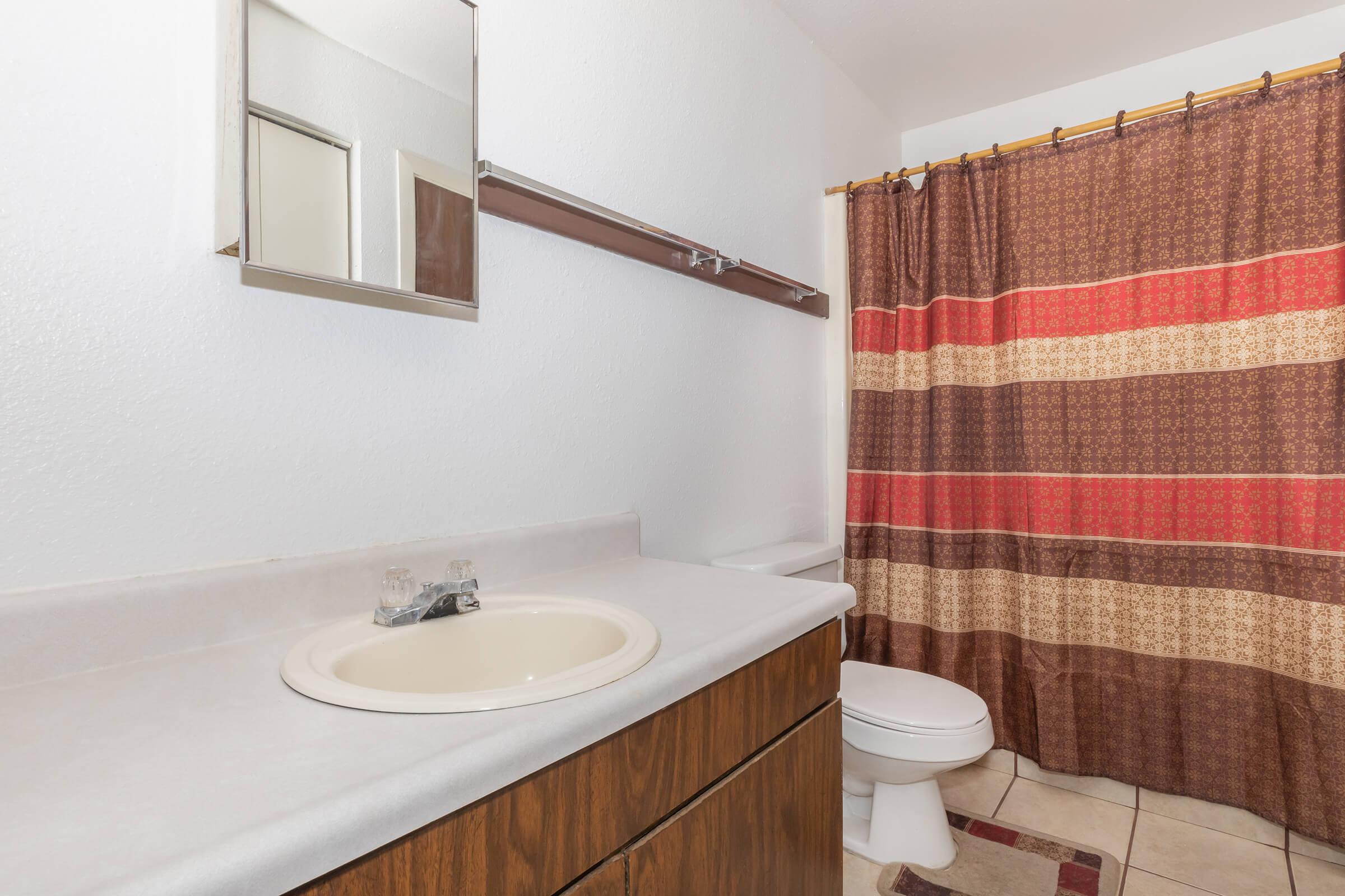 a white tub sitting next to a sink