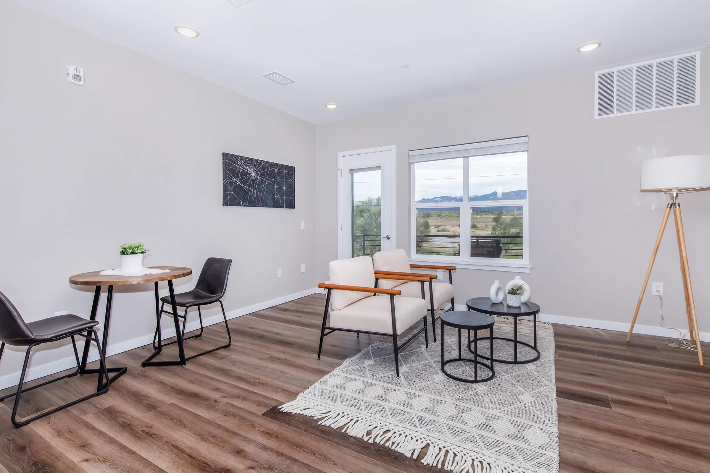 a living room with a wooden floor