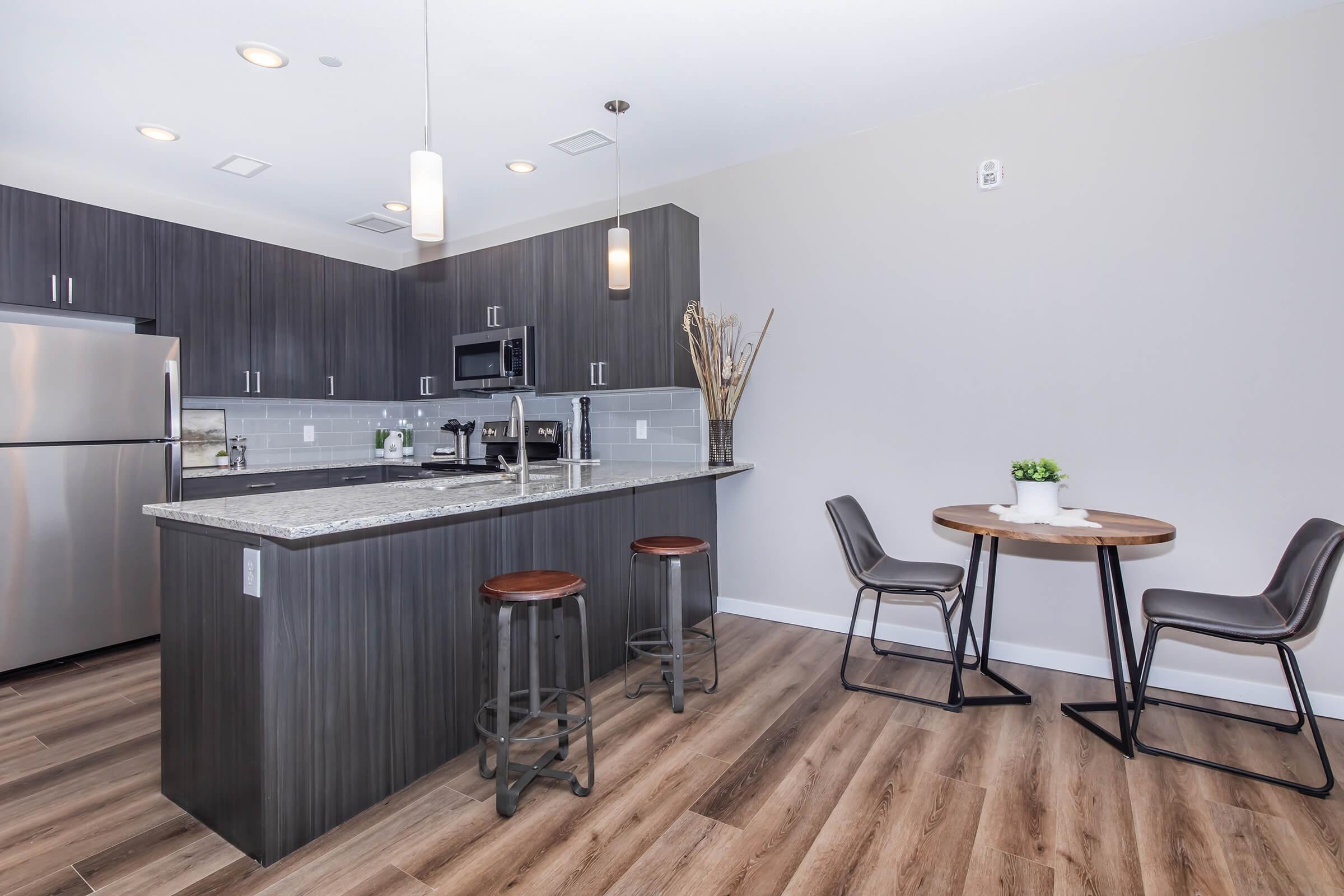 a kitchen with a table in a room