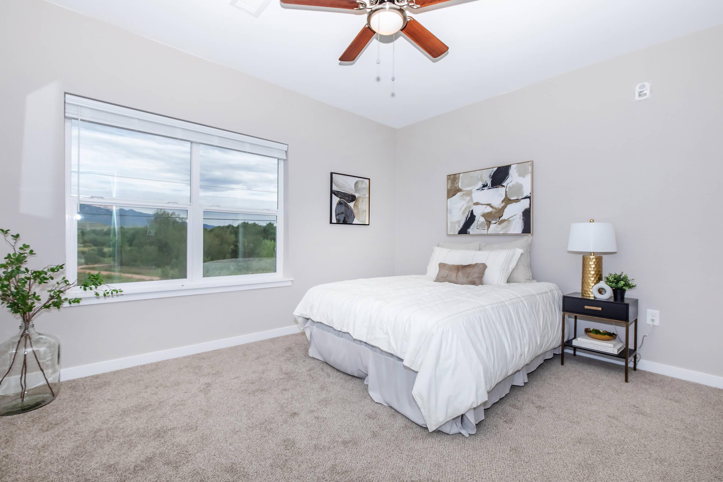 a bedroom with a large bed in a room