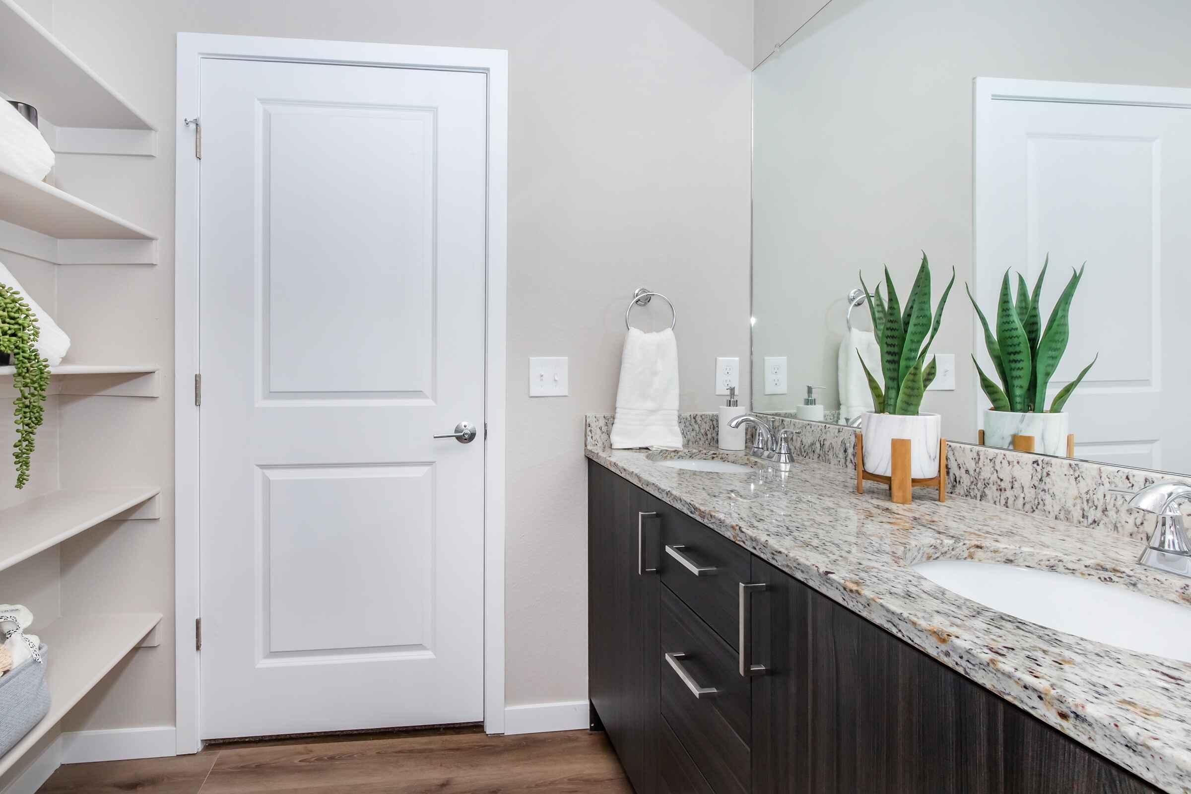 a kitchen with a sink and a mirror