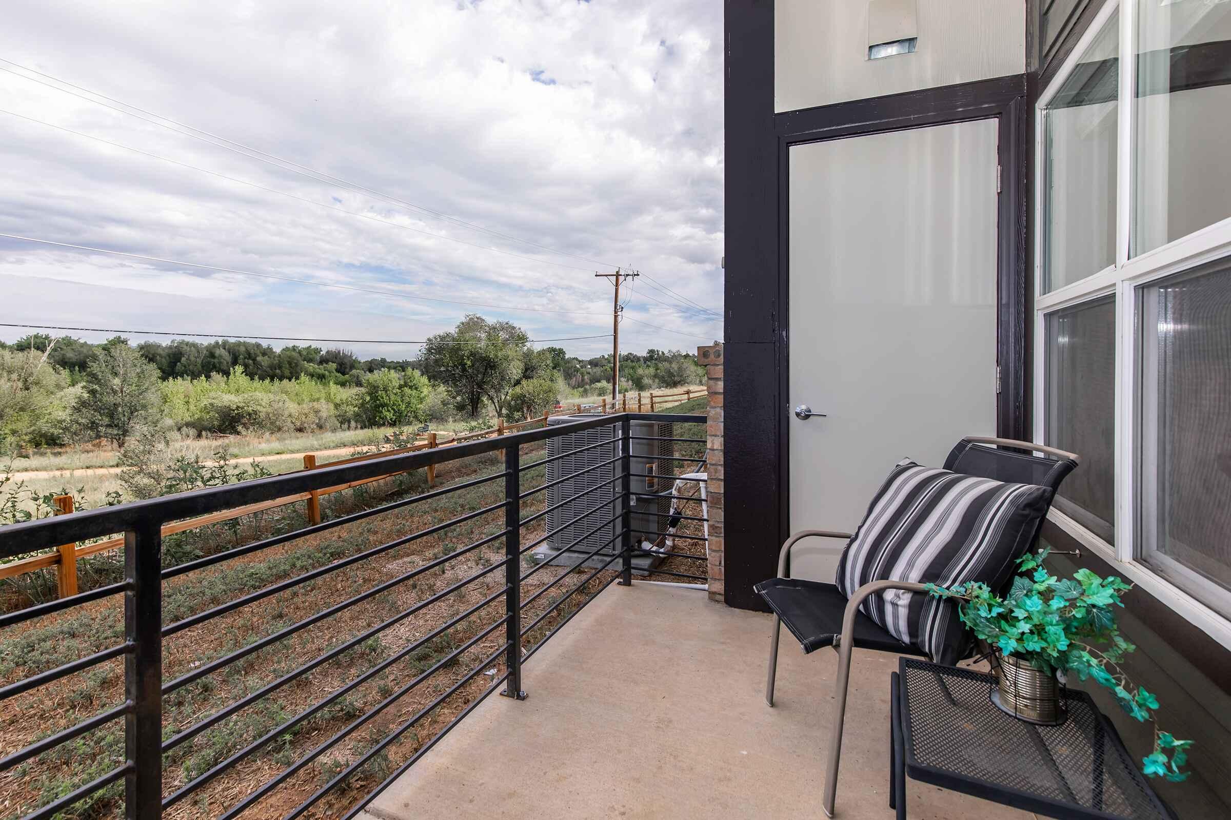 a chair sitting in front of a fence