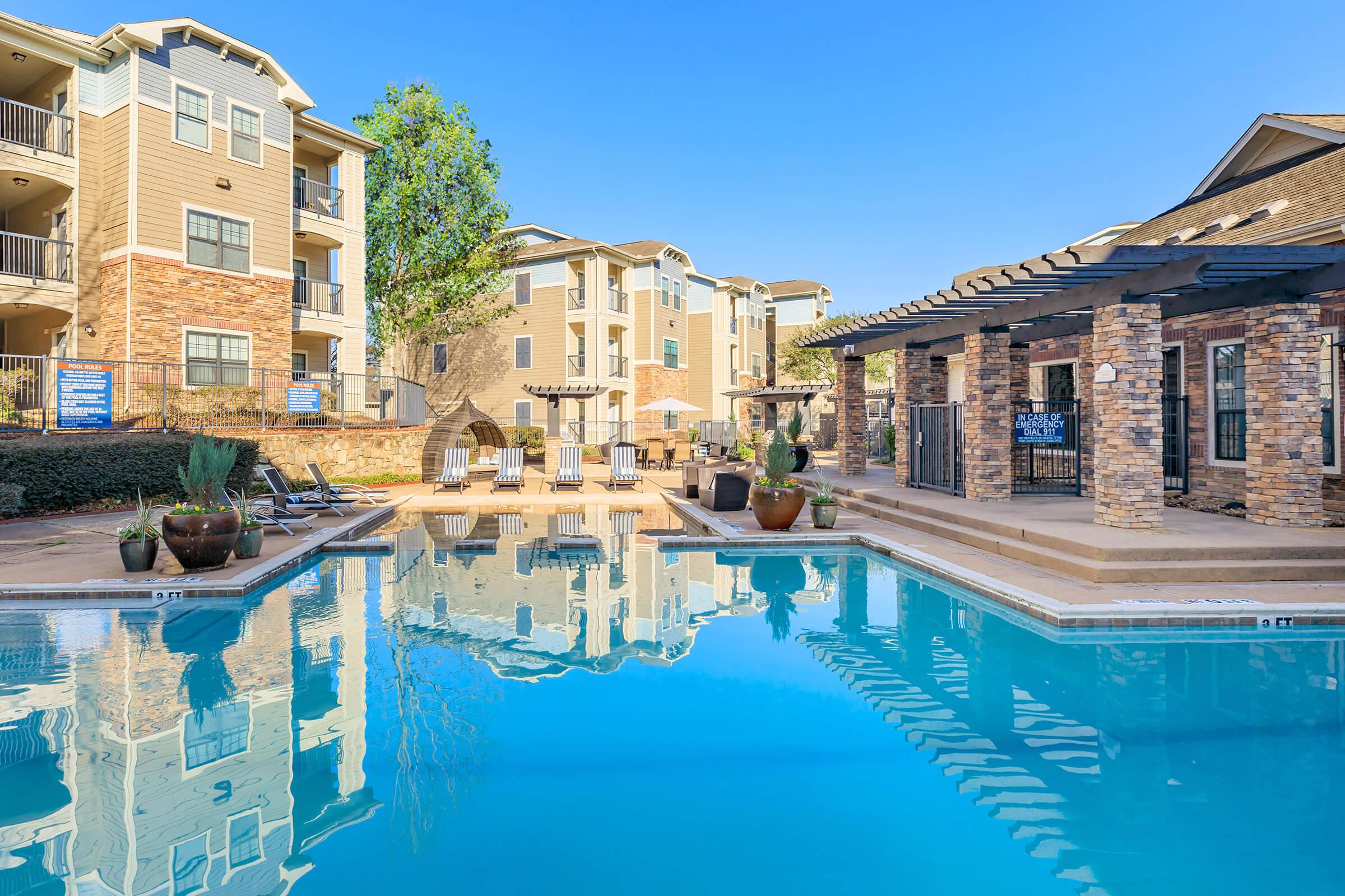 a large pool of water in front of a building