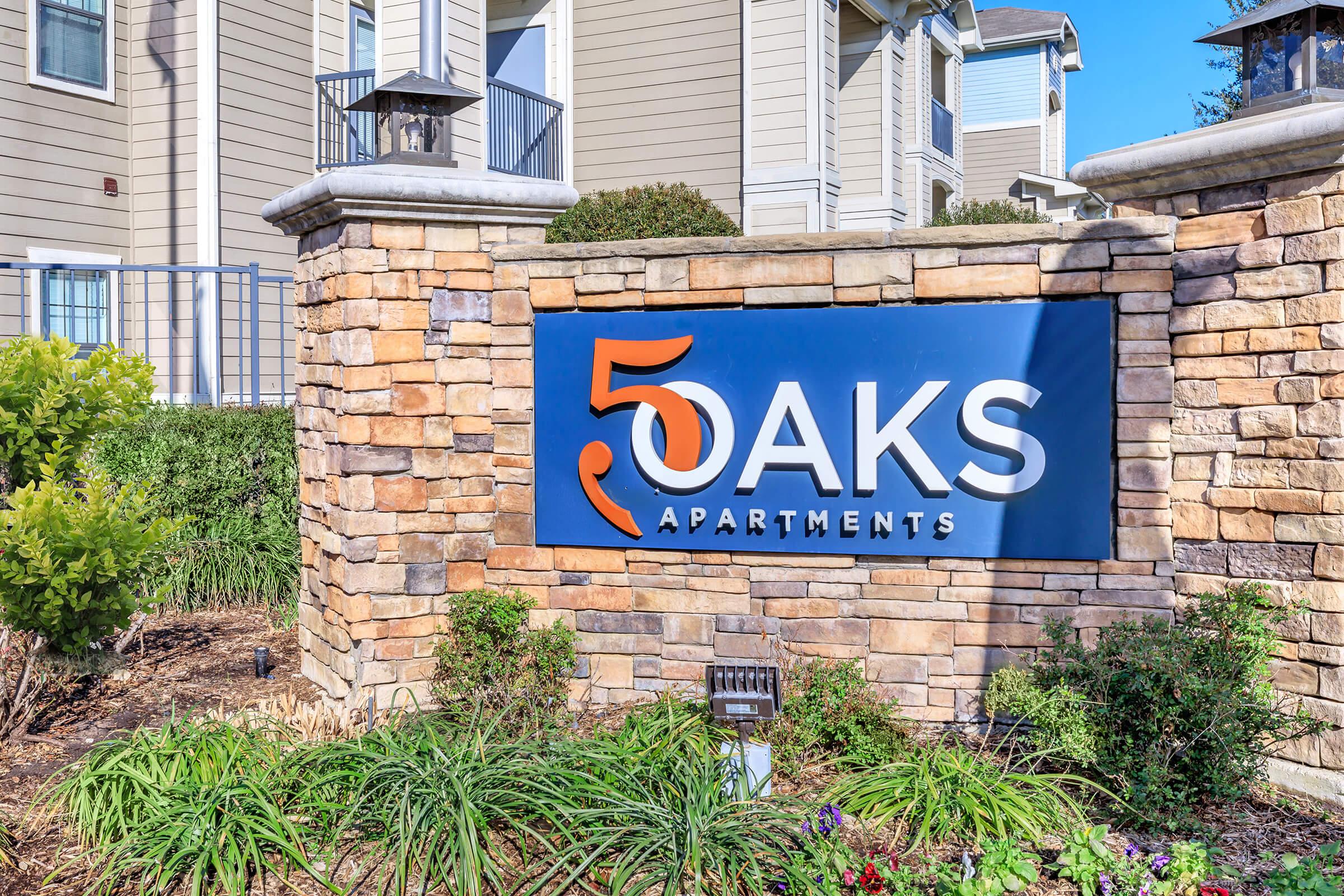 a sign in front of a brick building