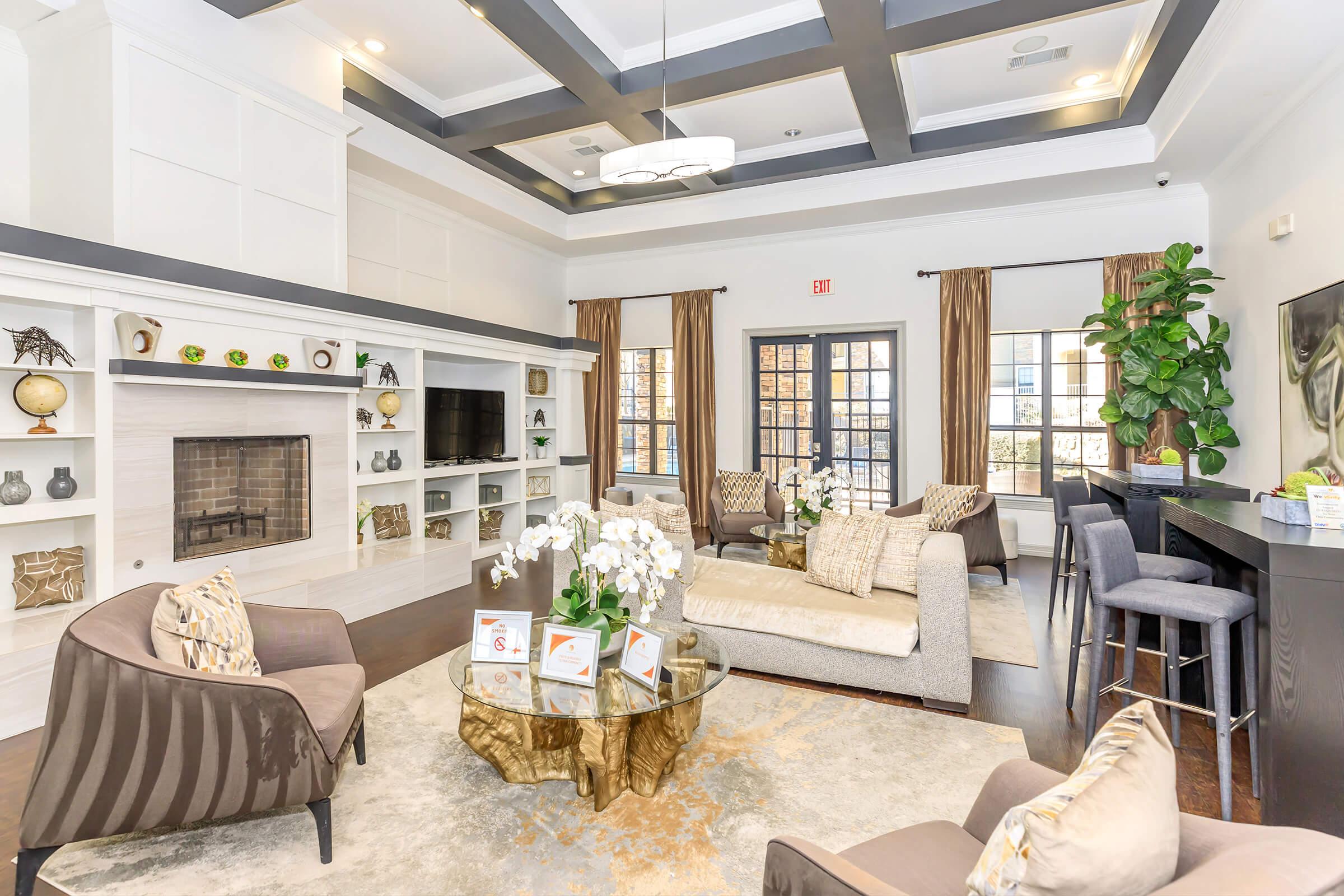 a living room filled with furniture and a fireplace