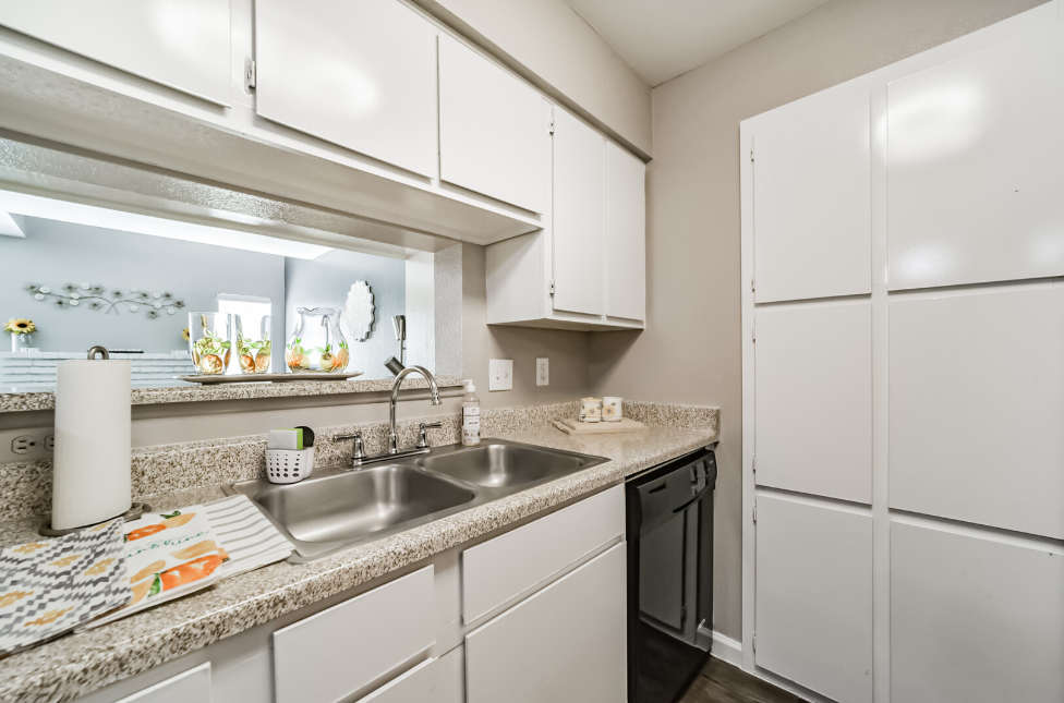 a kitchen with a stove and a sink