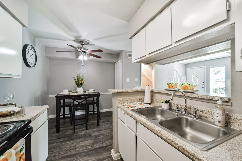 a kitchen with a sink and a window