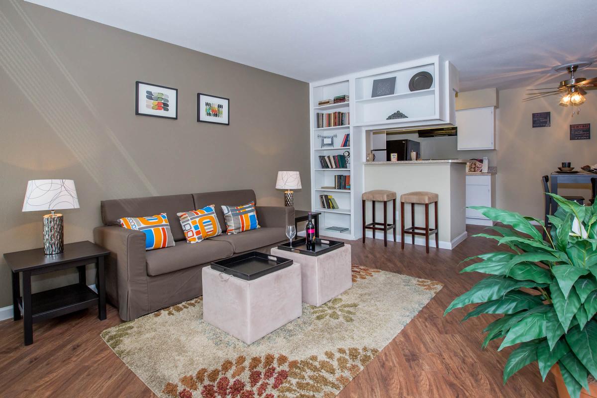 a living room filled with furniture and a flat screen tv