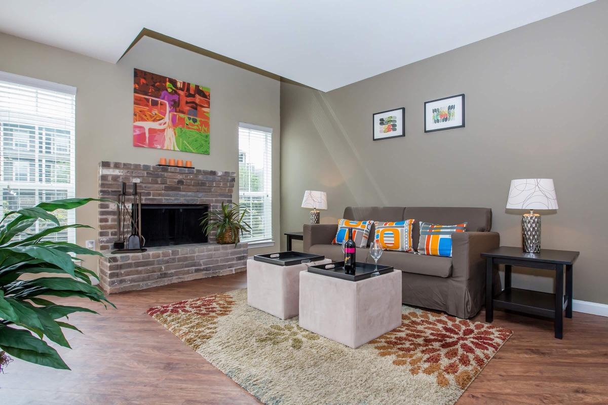 a living room filled with furniture and a flat screen tv