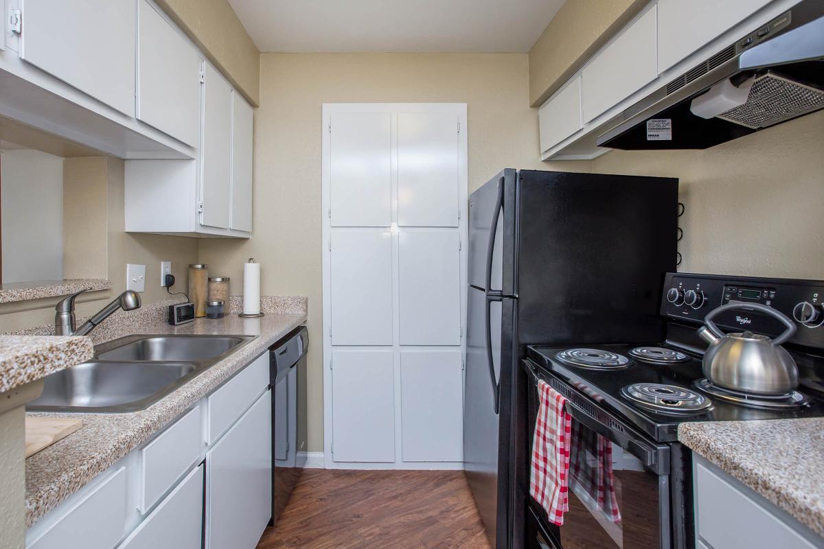 a kitchen with a stove and a sink