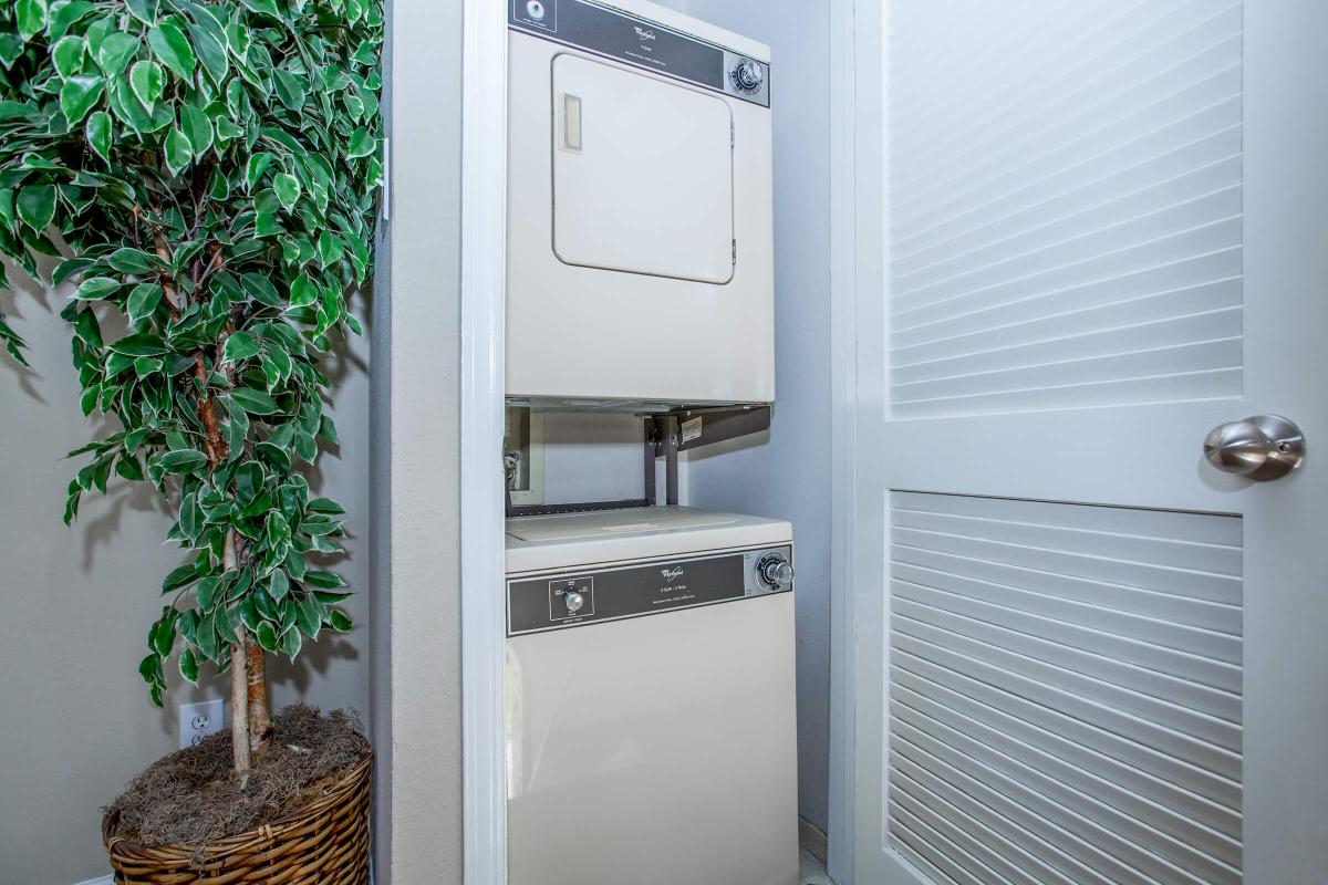 a white refrigerator freezer sitting next to a window