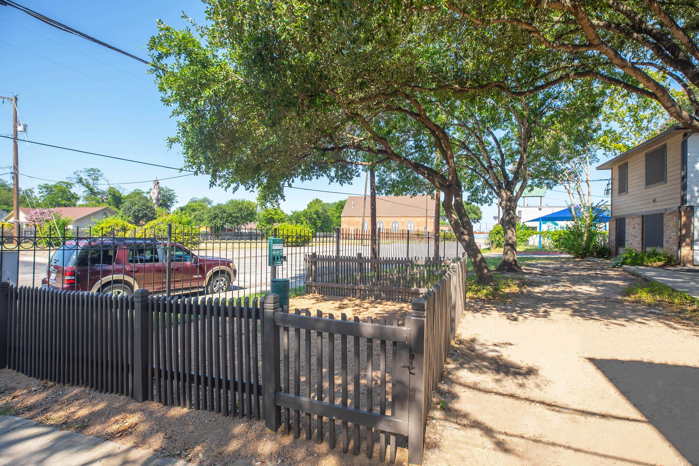 a street scene with focus on the side of a fence