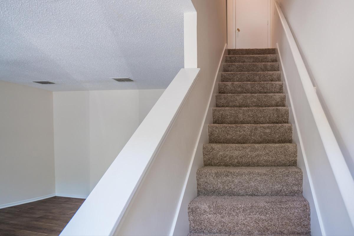 Stair Case in Three Bedroom Apartment at Willow Pointe in Antioch