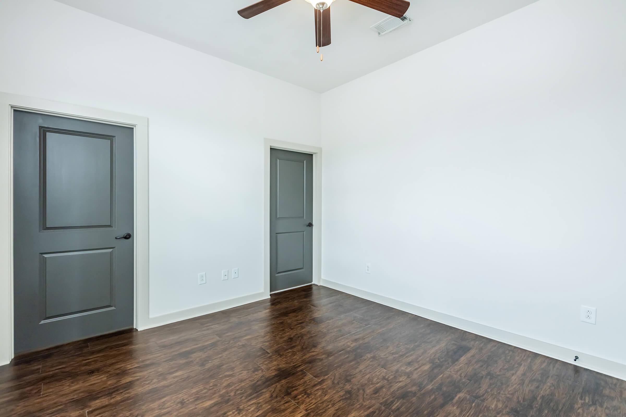 Master bedroom hardwood floors and ceiling fan