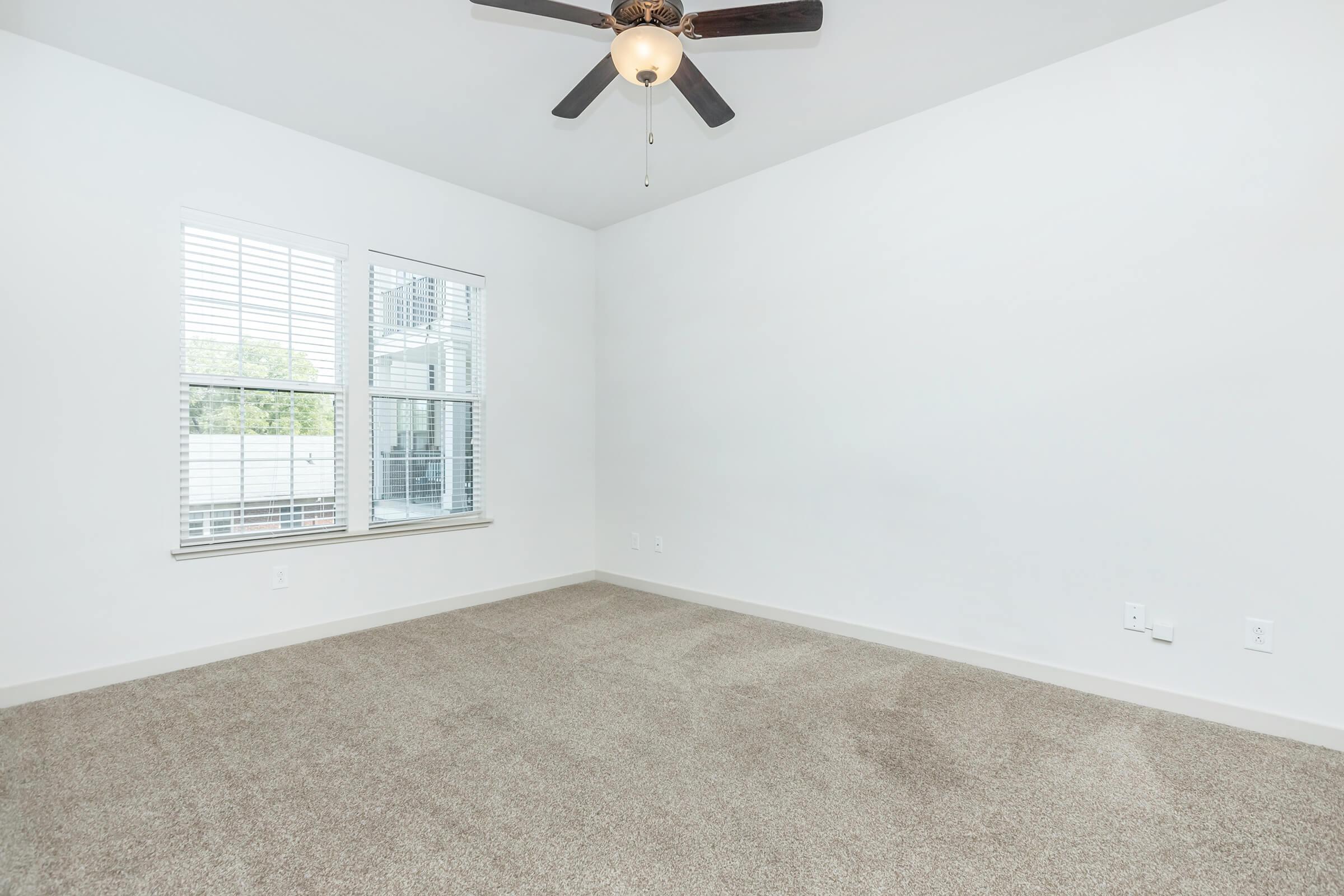 Bedroom  1with ceiling fan and window