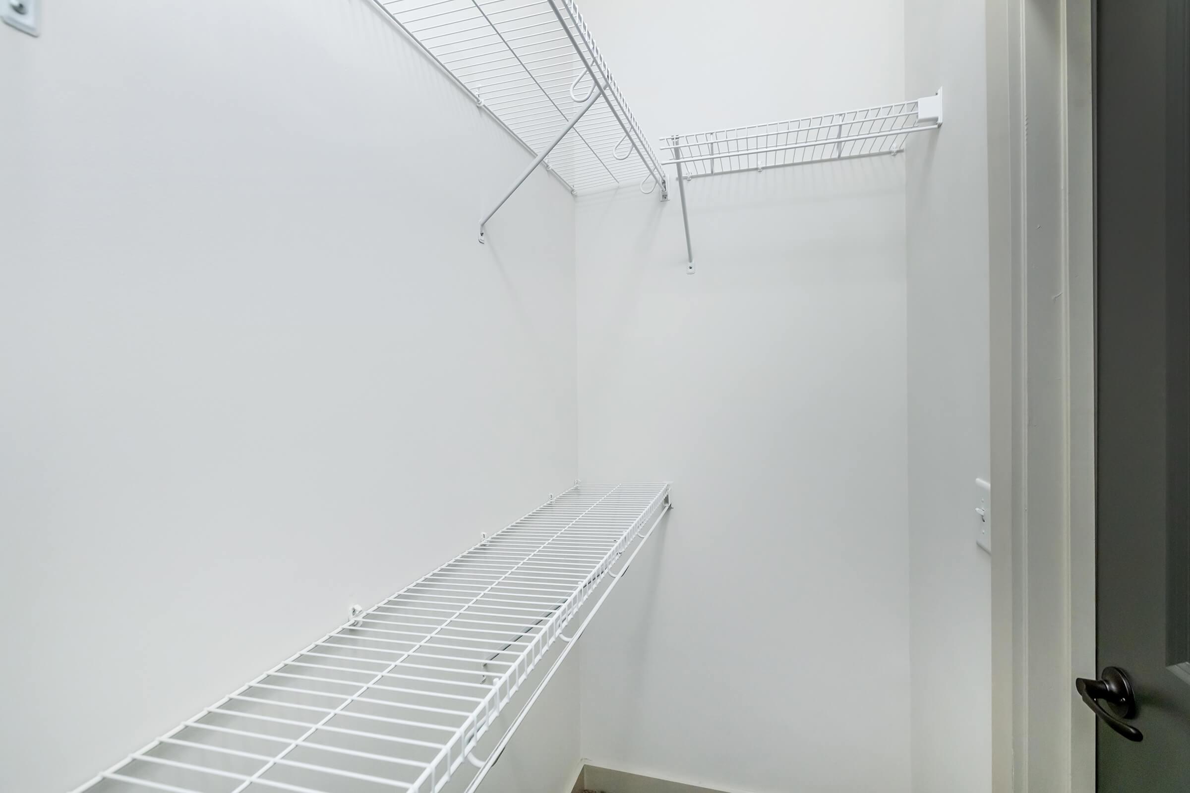 Closet interior with shelving in bedroom 1