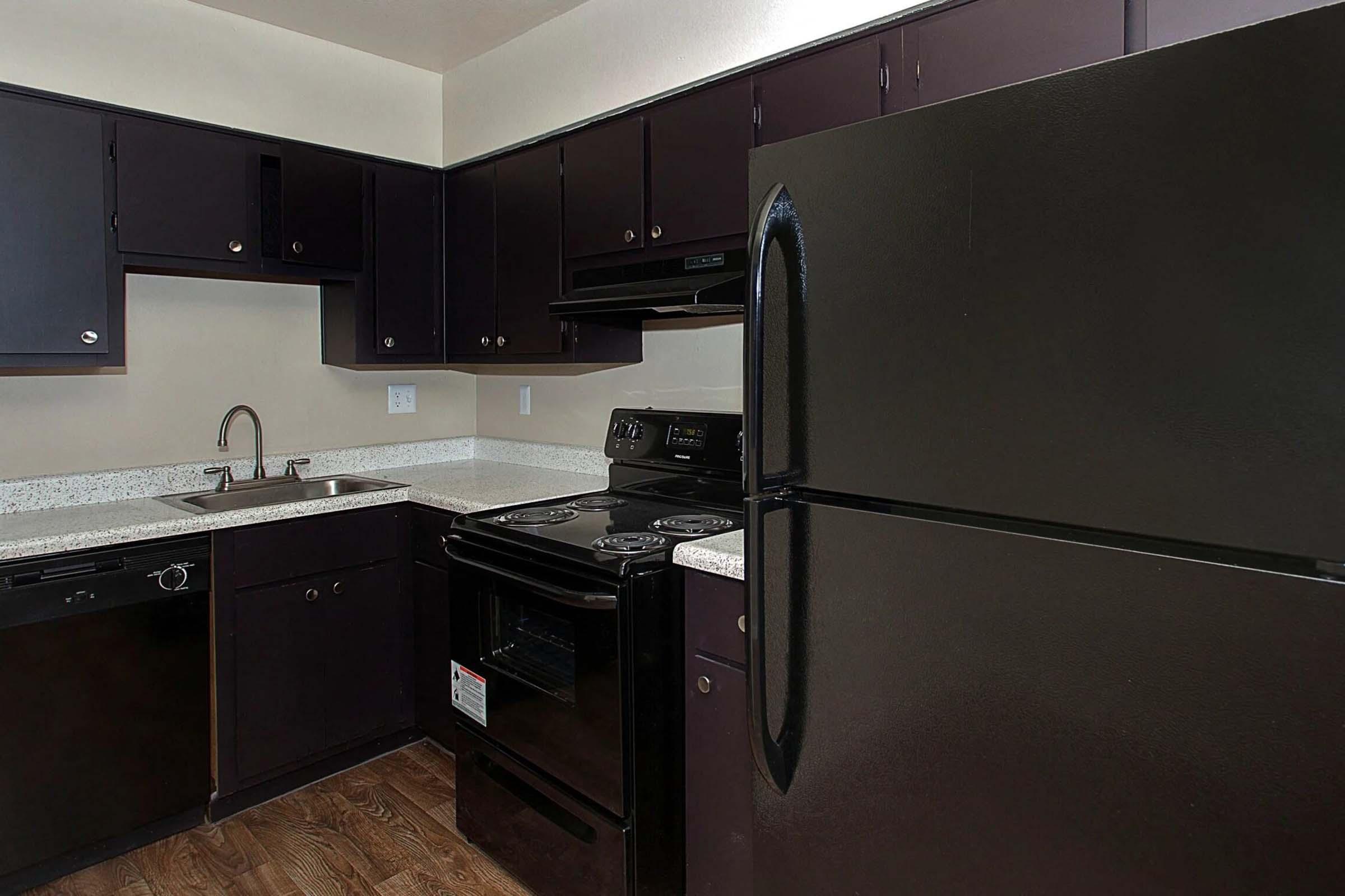 a large kitchen with stainless steel appliances