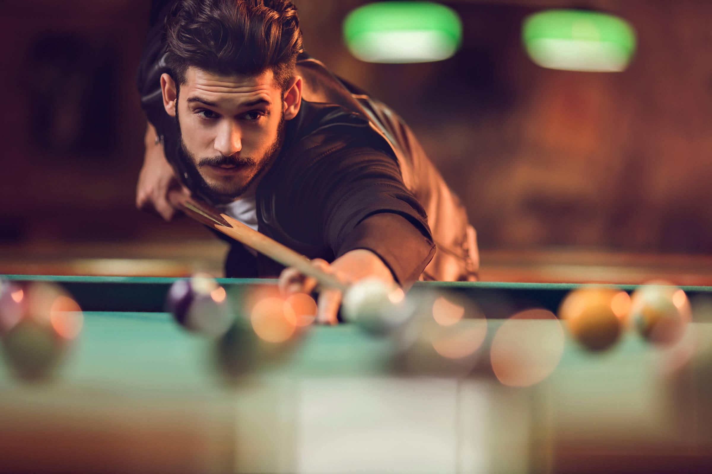 Copy of Copy of Young man playing billiard in a pool hall iStock_78986005_LARGE.jpg