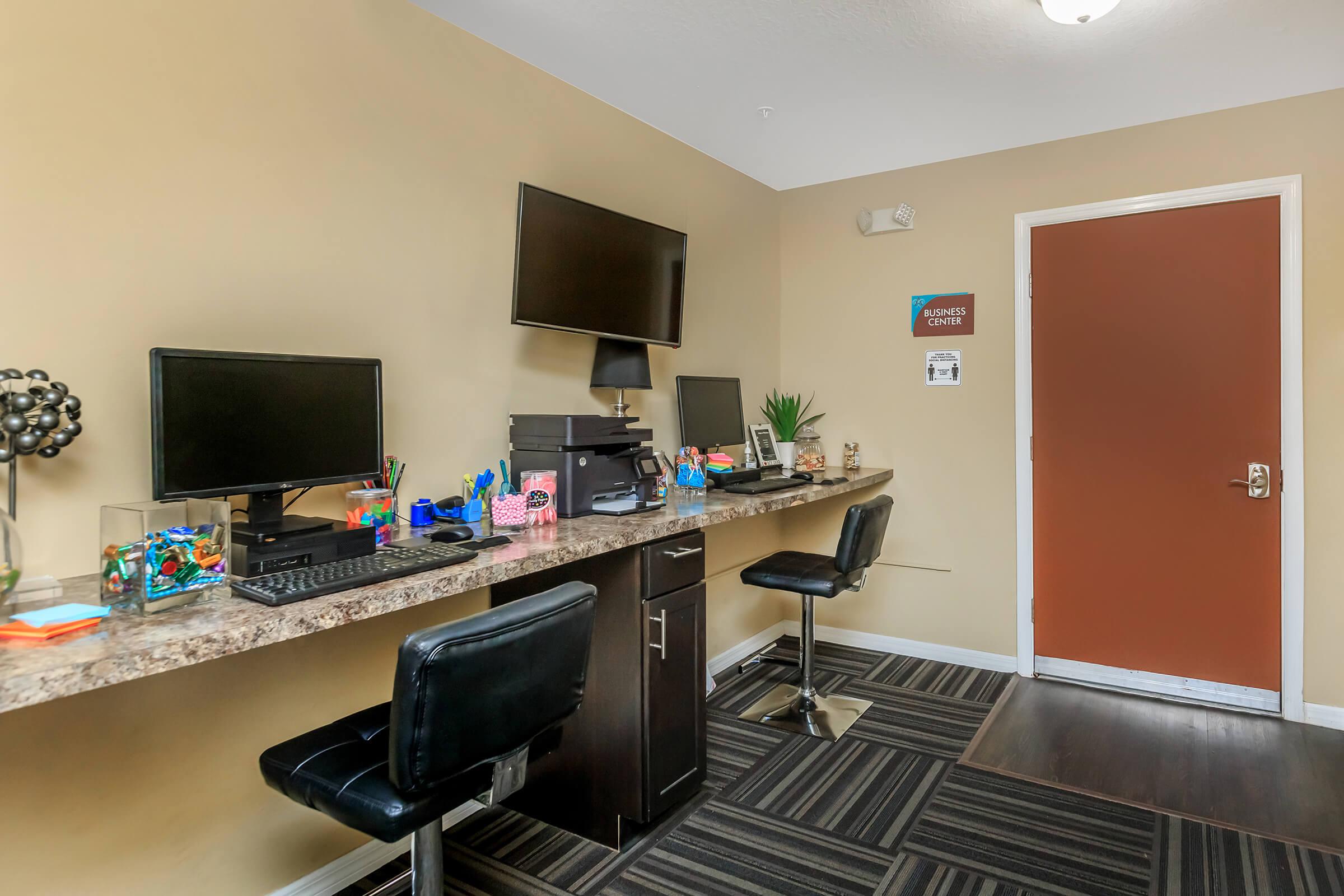 a room filled with furniture and a flat screen tv