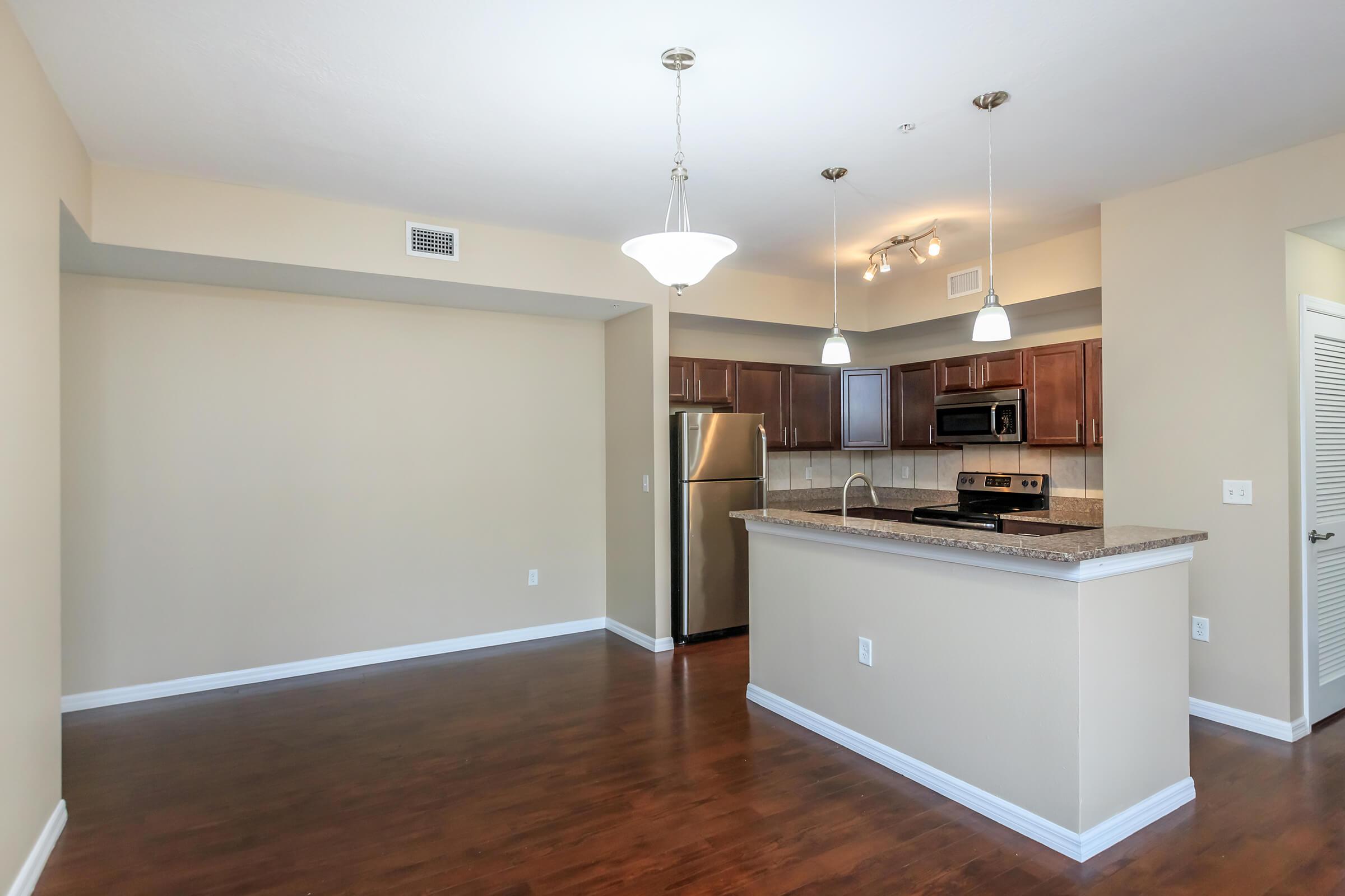 a kitchen with a wood floor