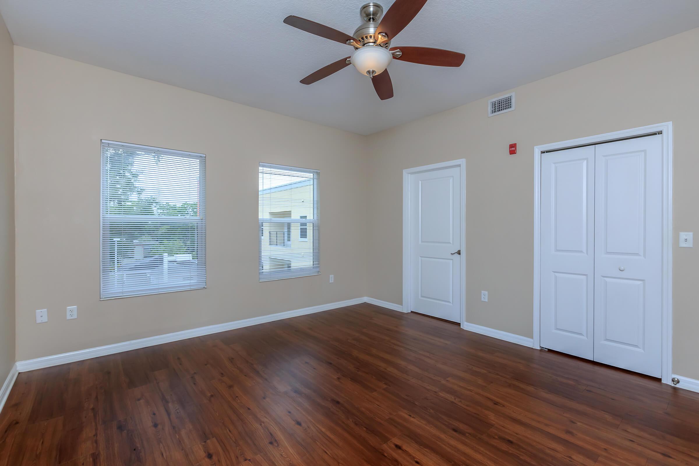 a living room with hard wood floors