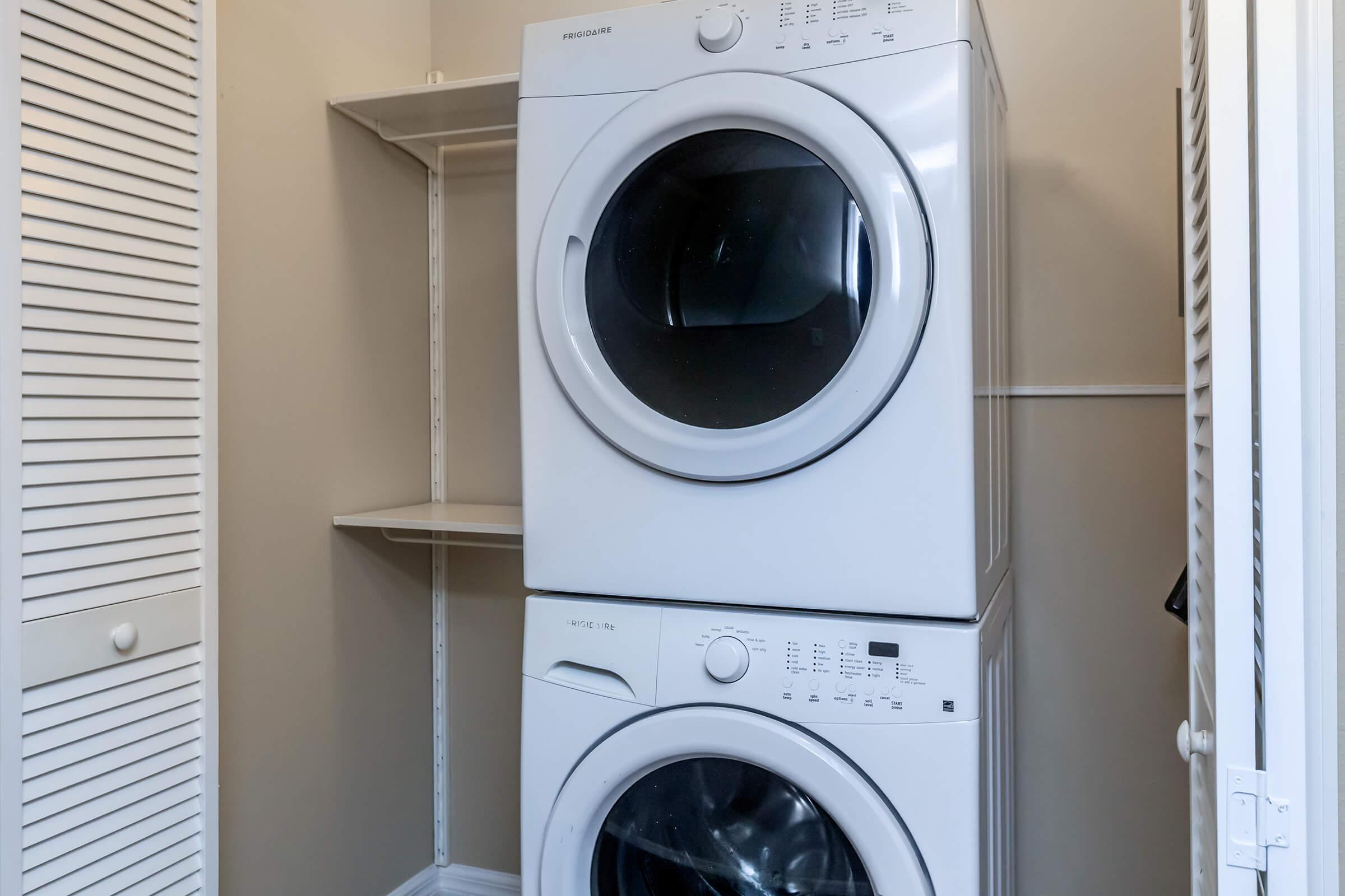a washer and dryer next to a window