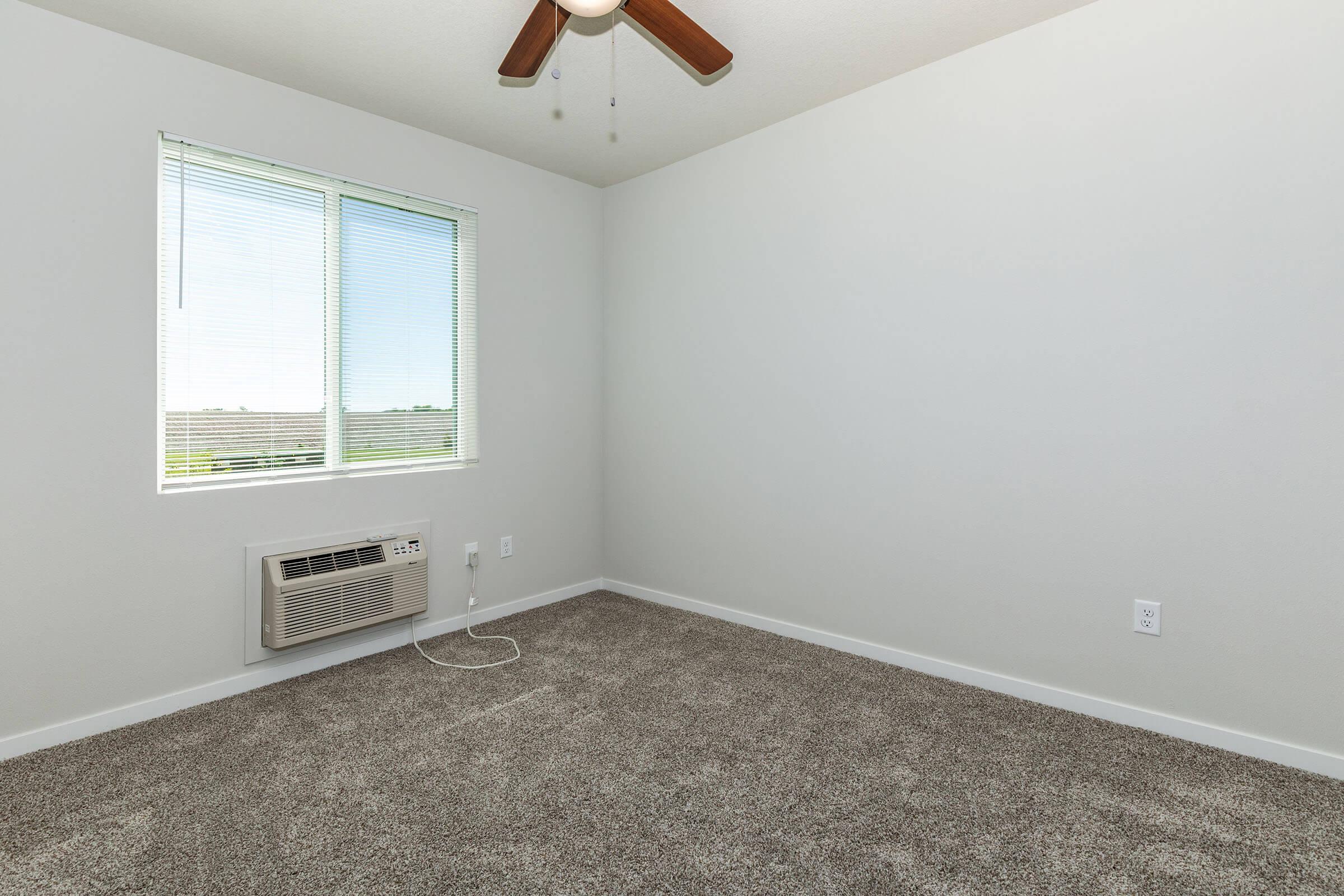 a bedroom with a large window