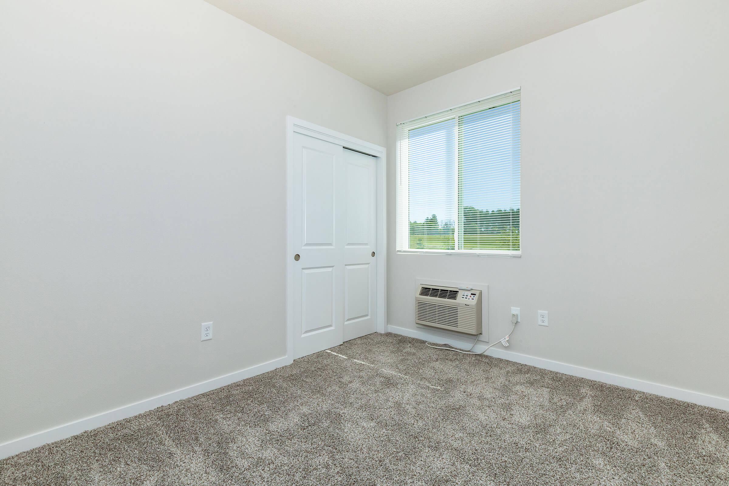 a bedroom with a large mirror