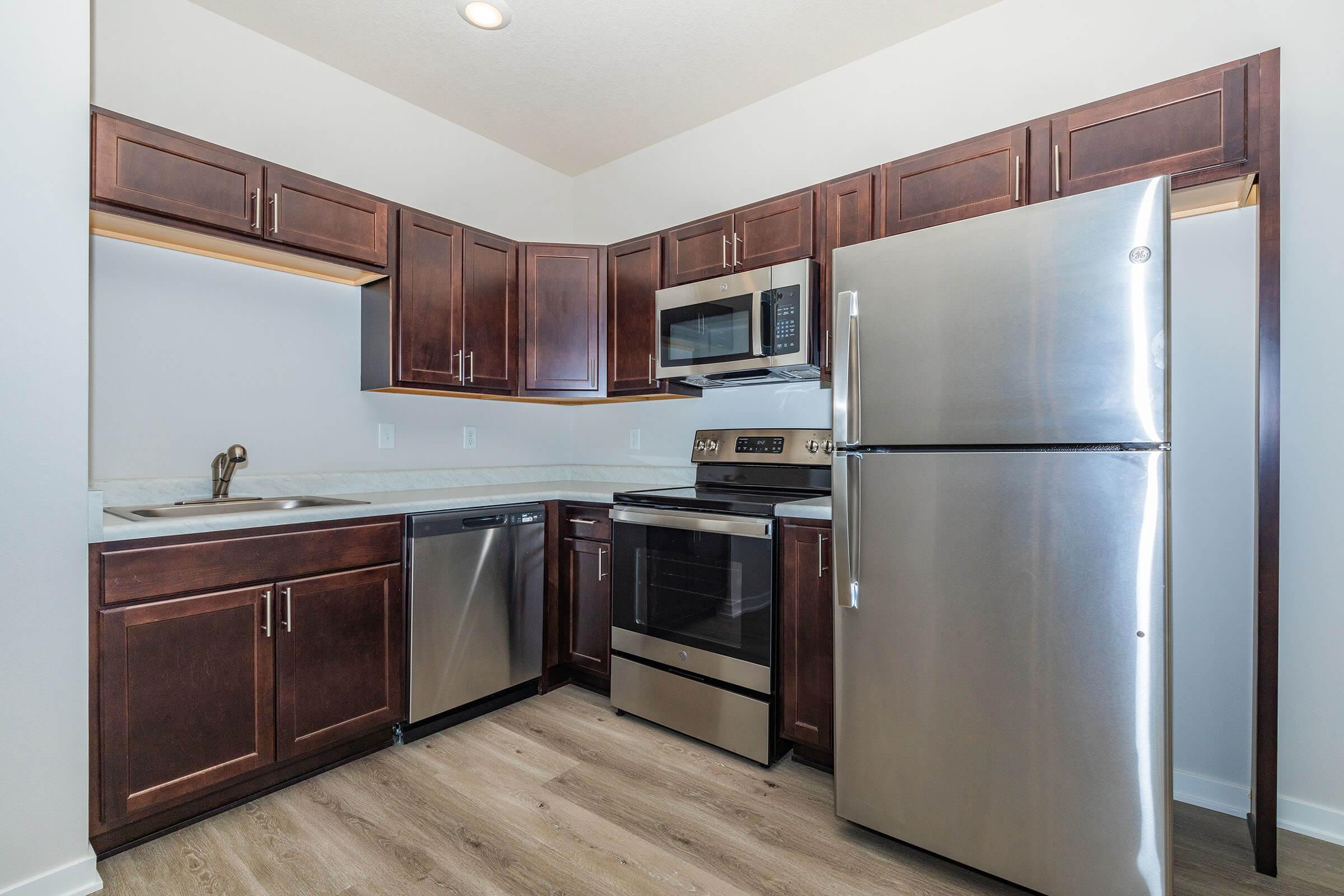 a stainless steel refrigerator in a kitchen