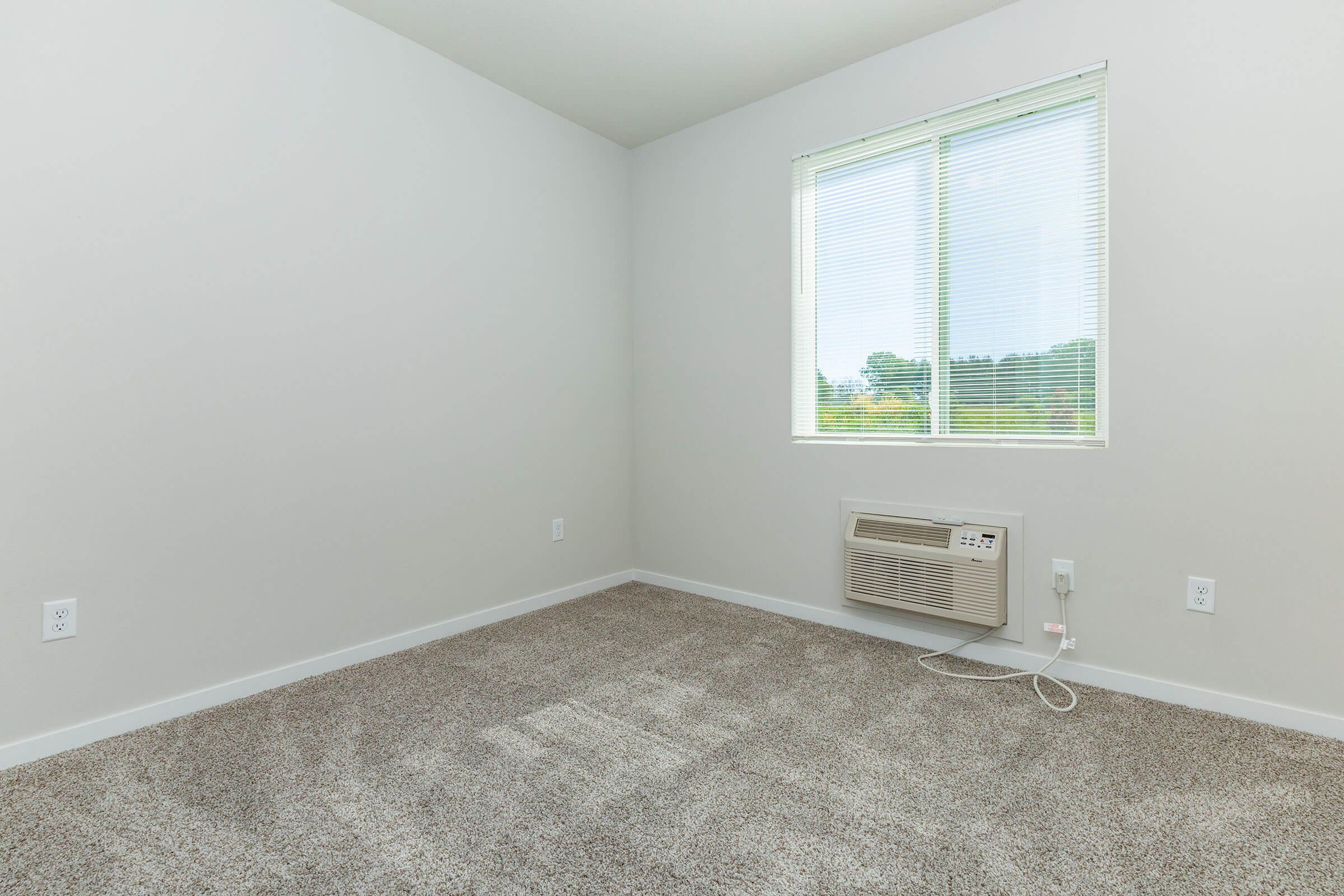 a bedroom with a large mirror