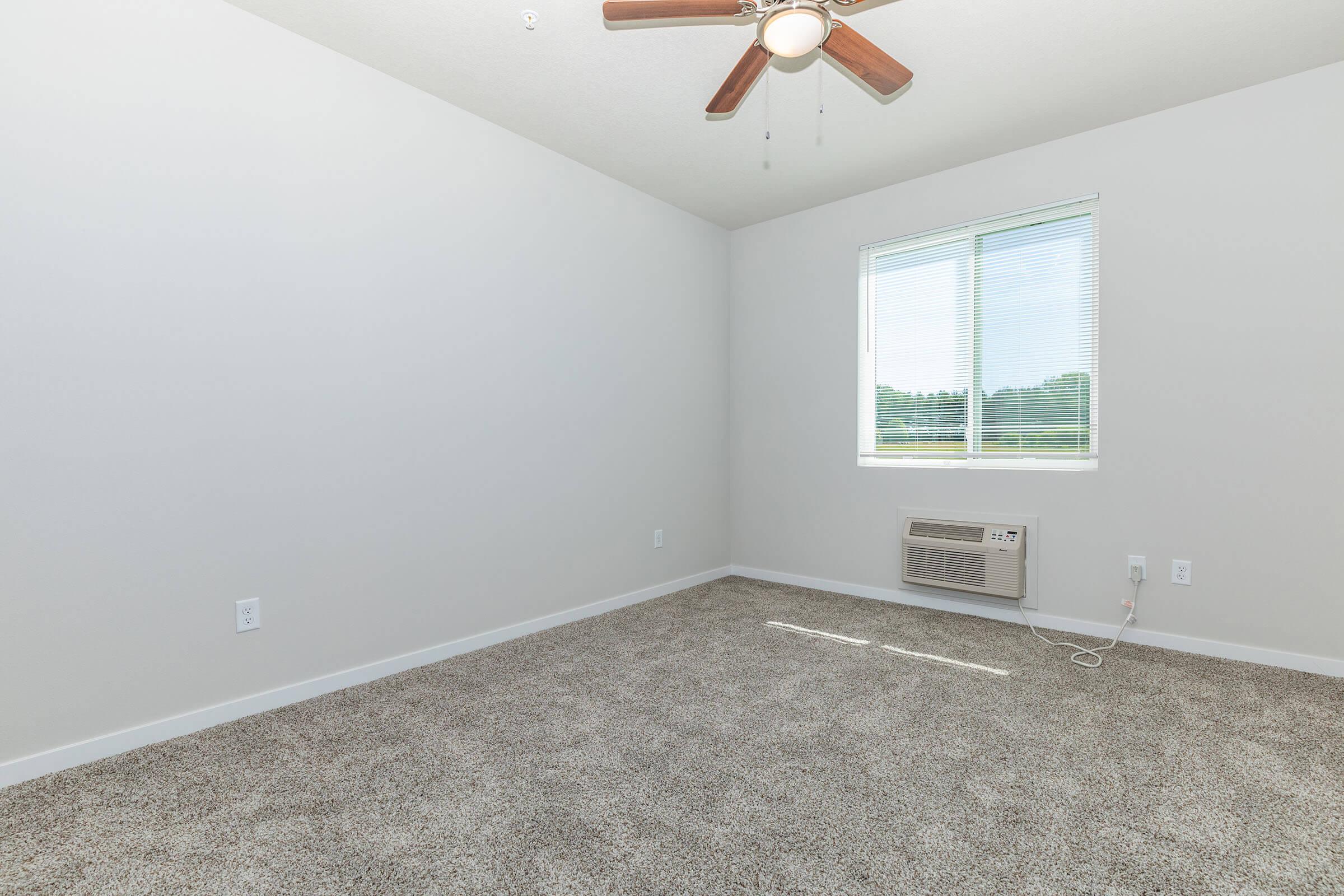 a view of a bedroom next to a window