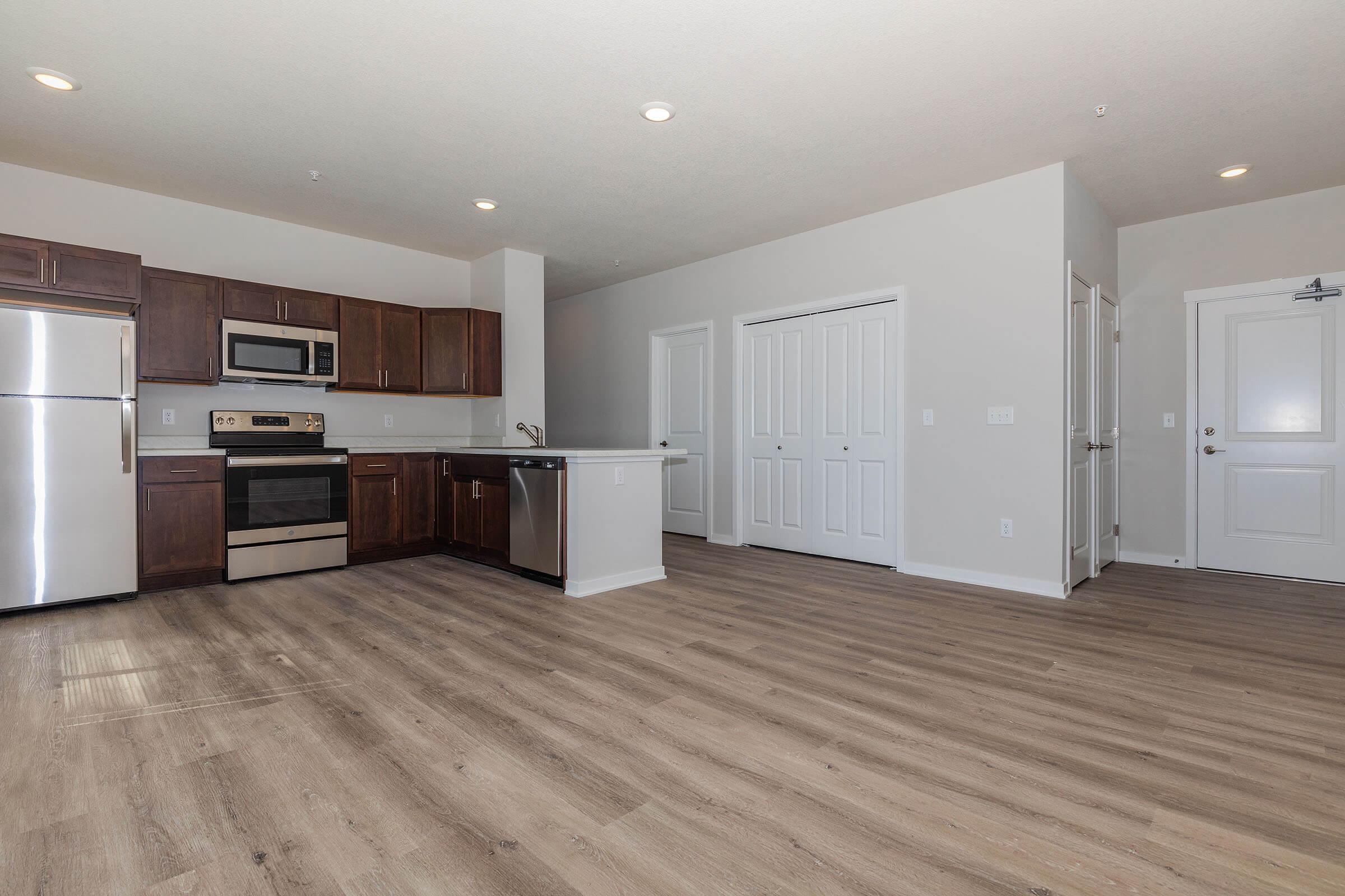 a kitchen with a wood floor