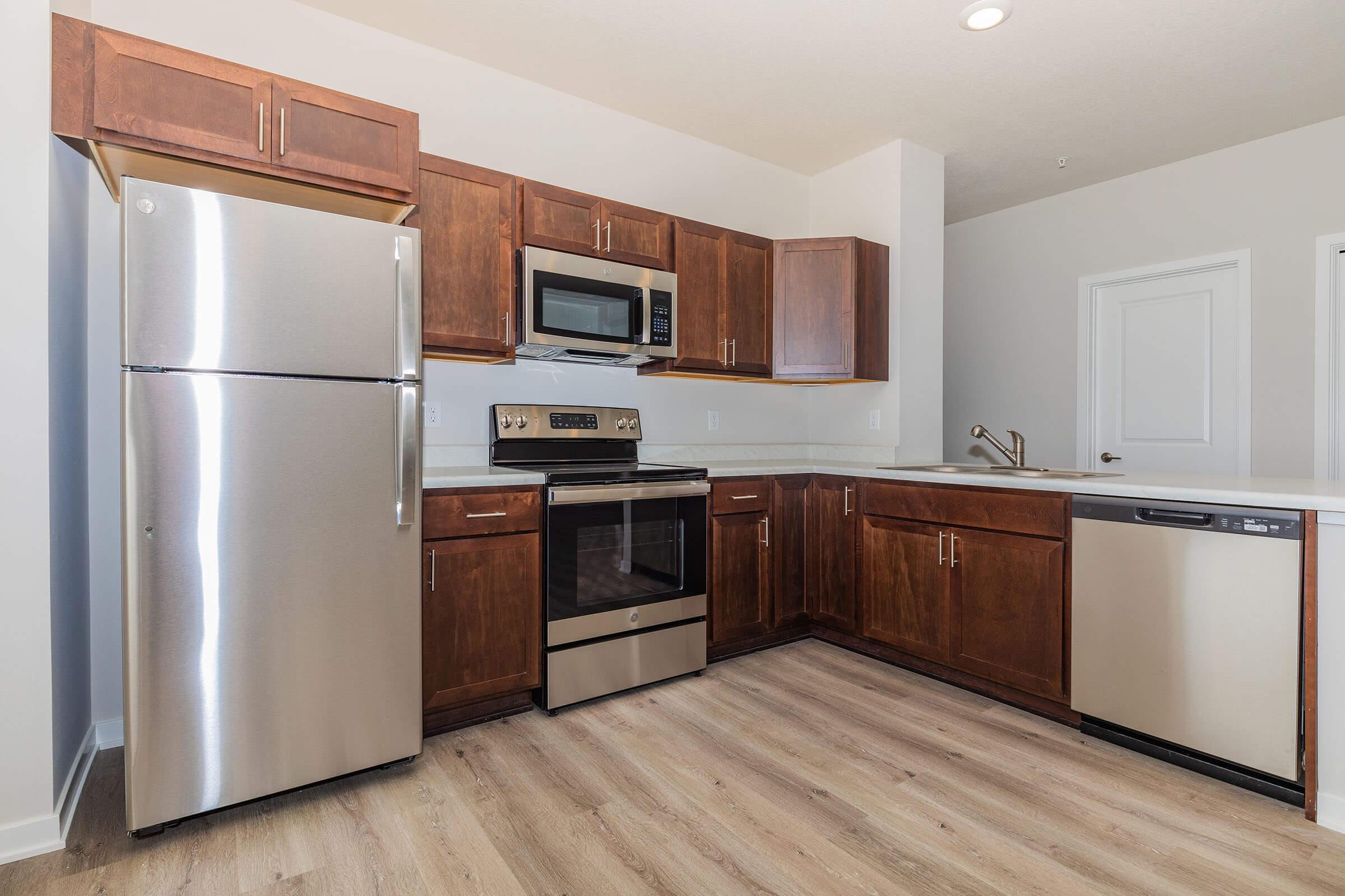 a stainless steel refrigerator in a kitchen