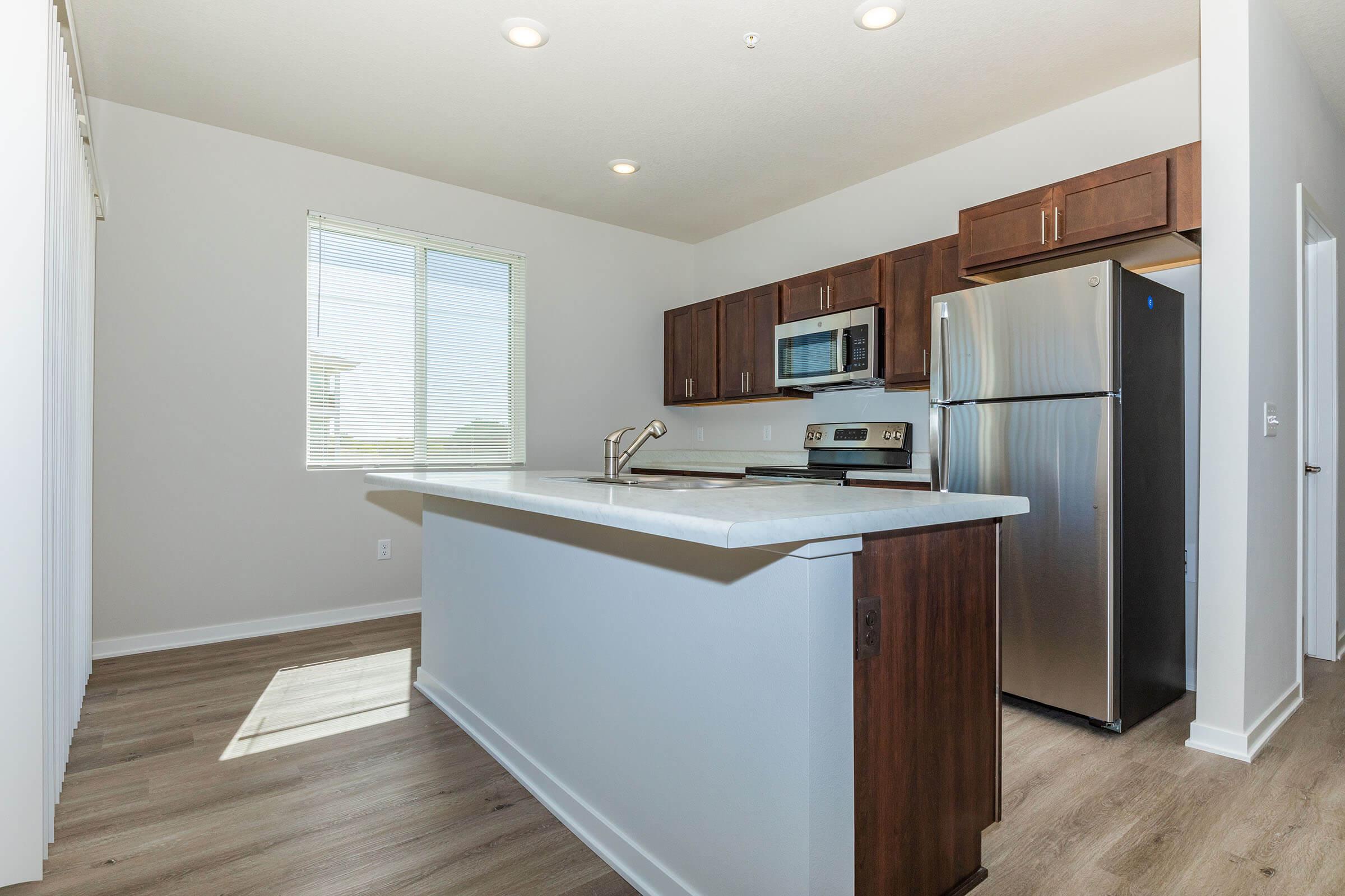 a kitchen with a wood floor