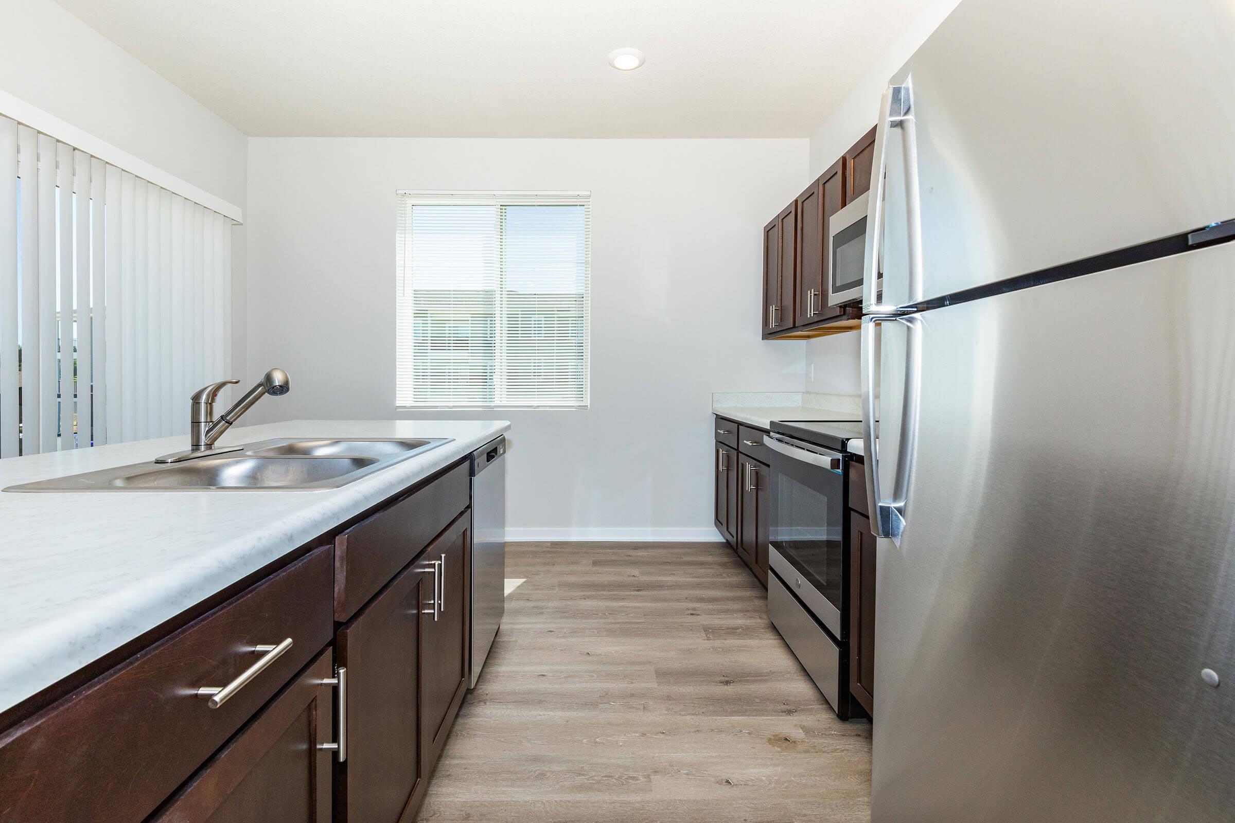 a kitchen with a sink and a window