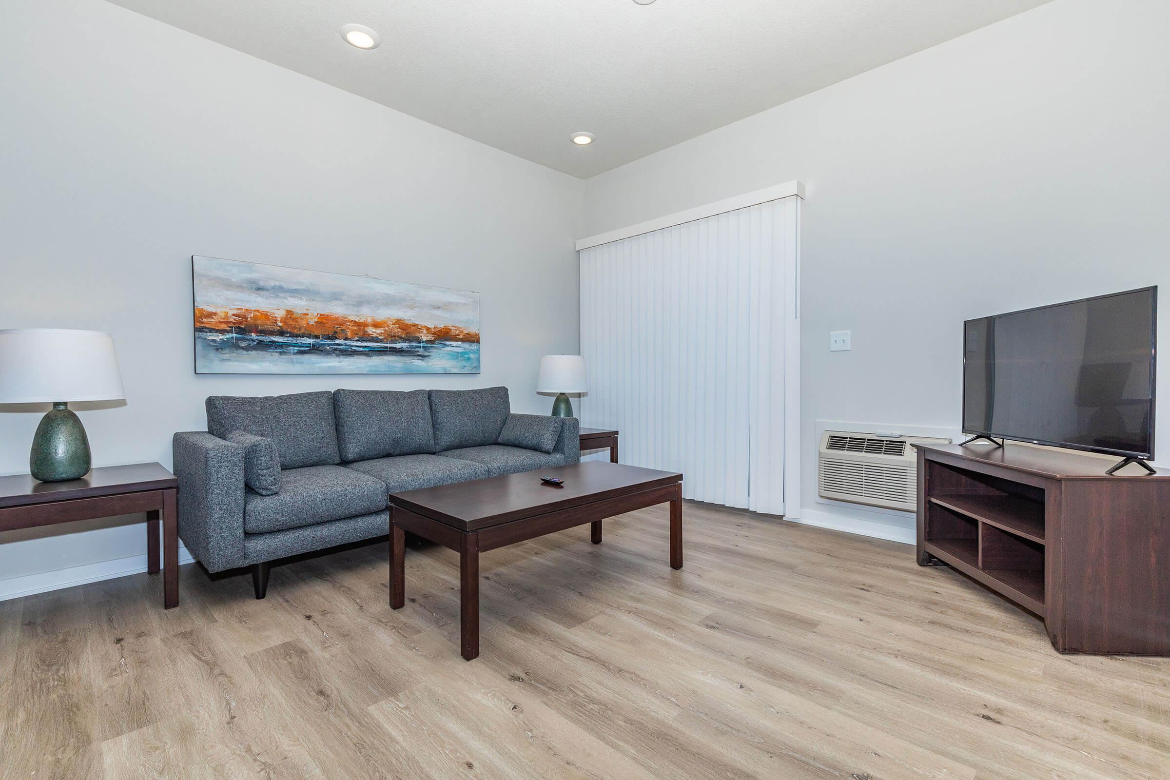 a living room with a wooden floor