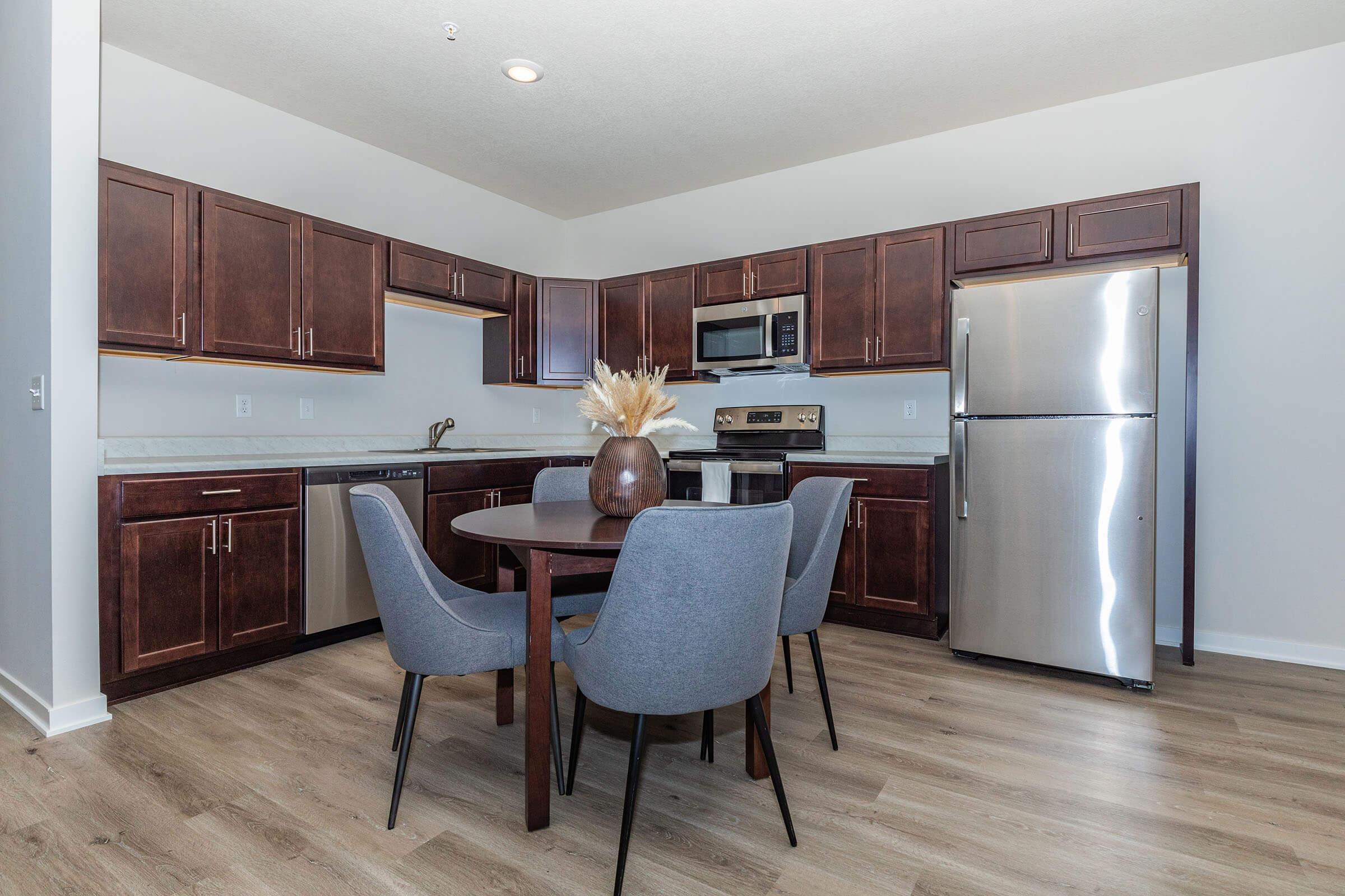 a kitchen with a dining room table