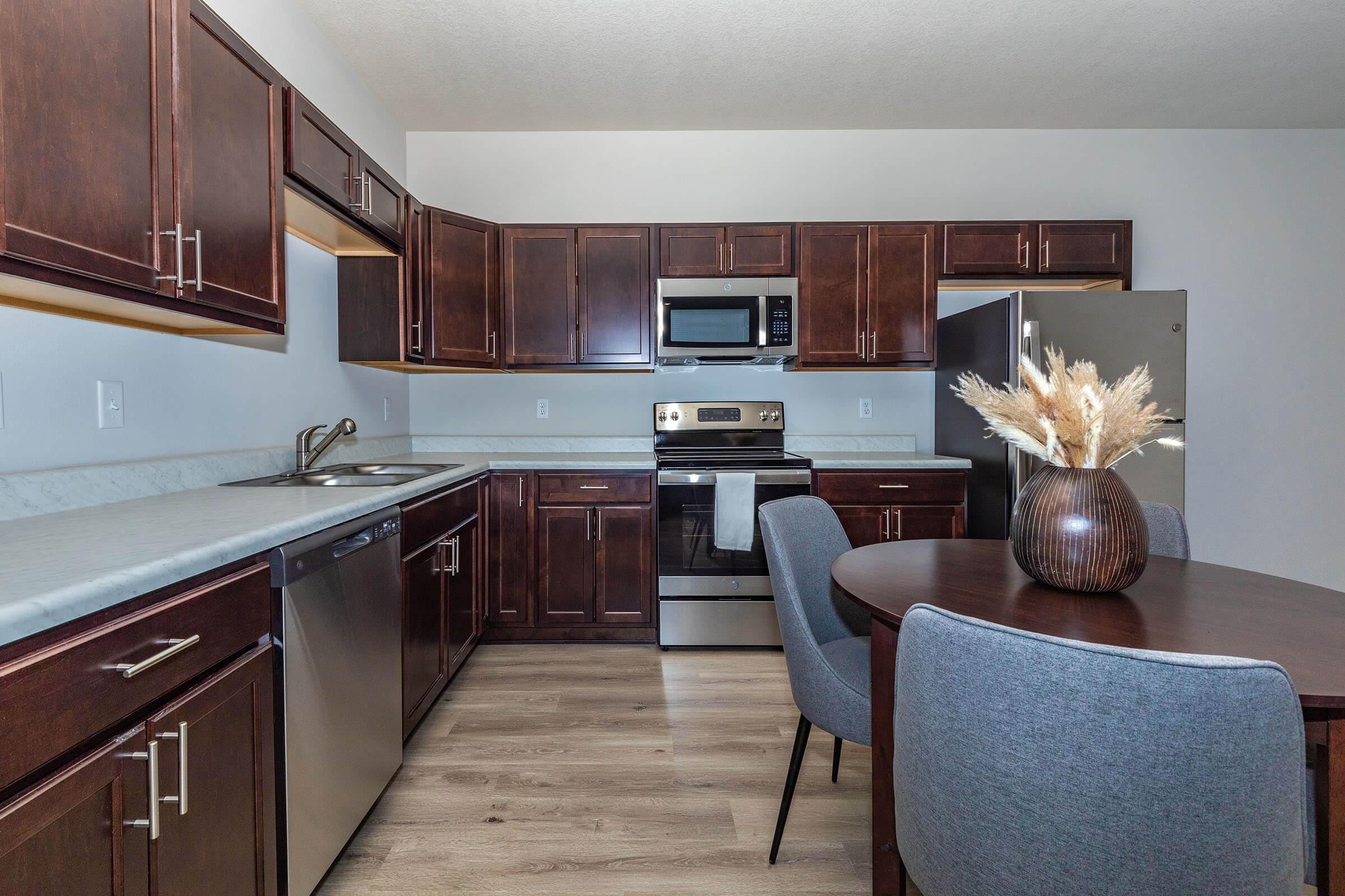 a kitchen filled with lots of furniture