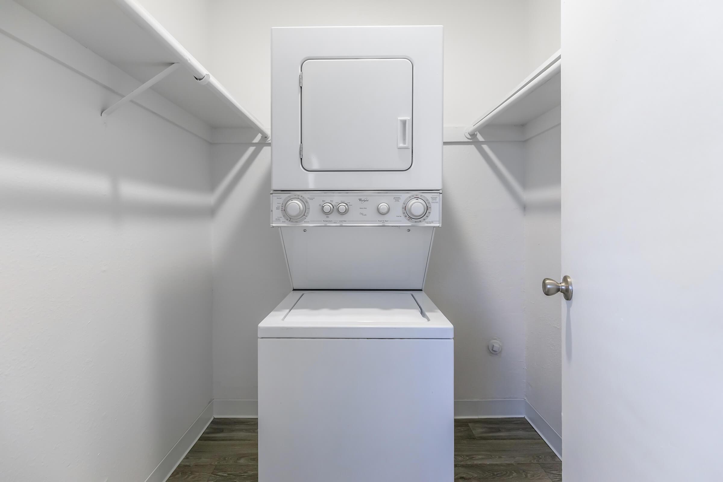 a refrigerator freezer sitting in a room