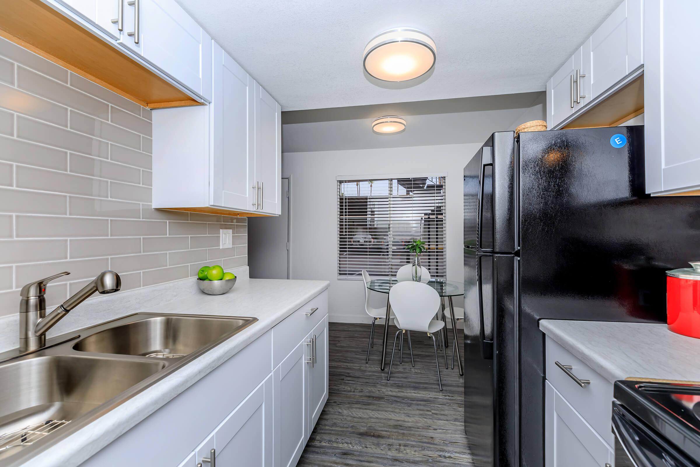 a large kitchen with stainless steel appliances