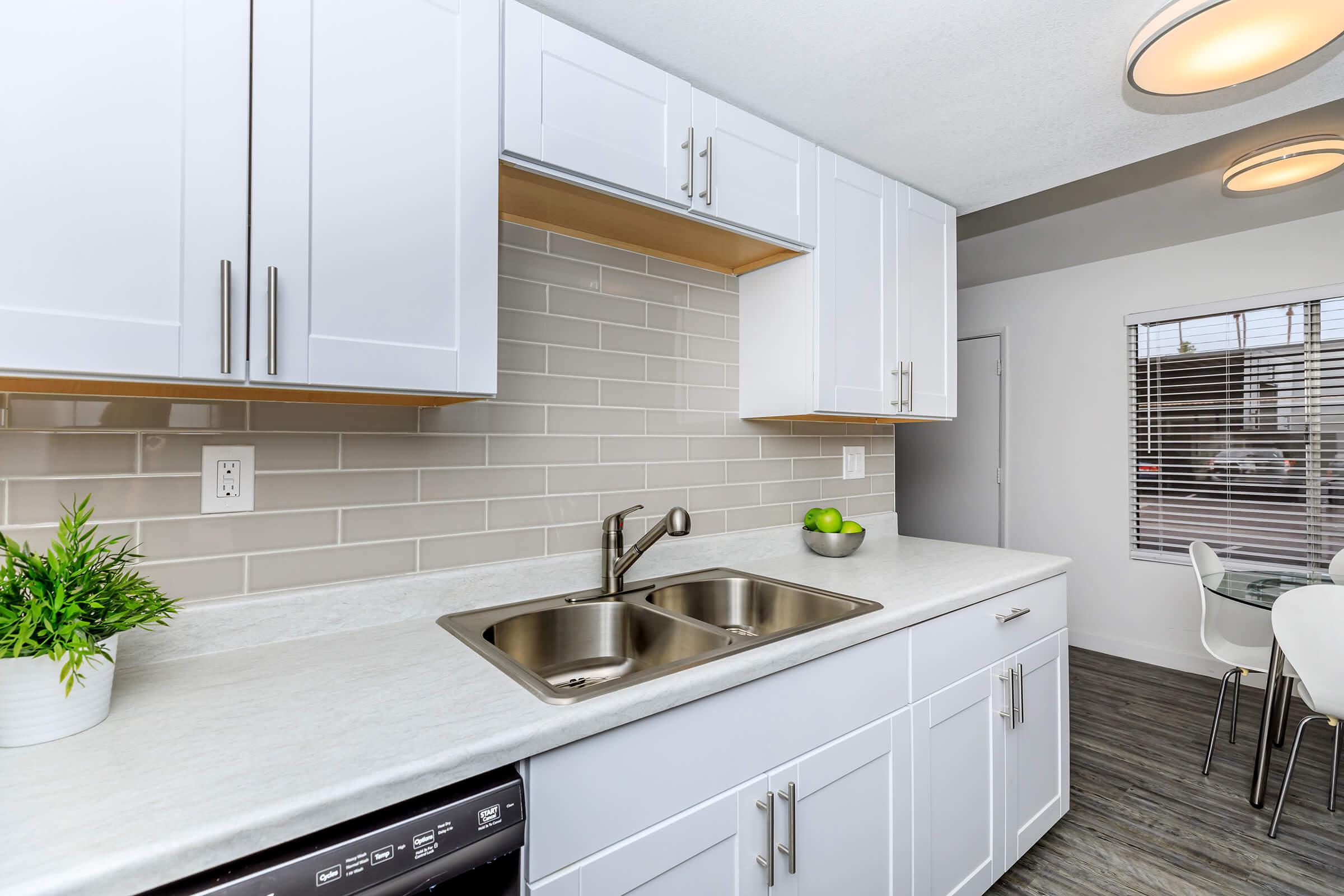 a kitchen with a sink and a window