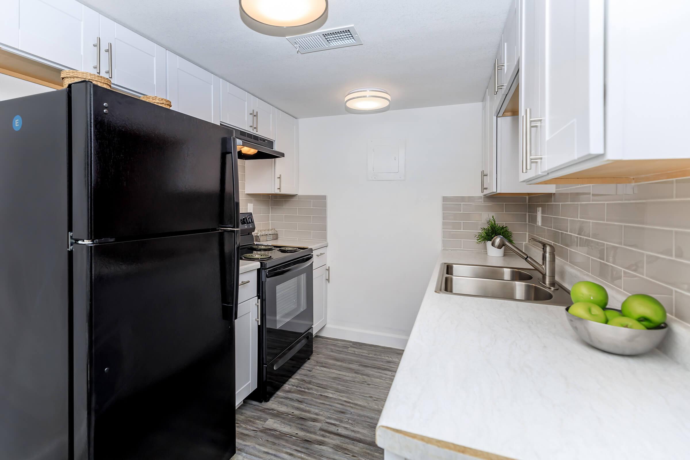 a stainless steel refrigerator in a kitchen