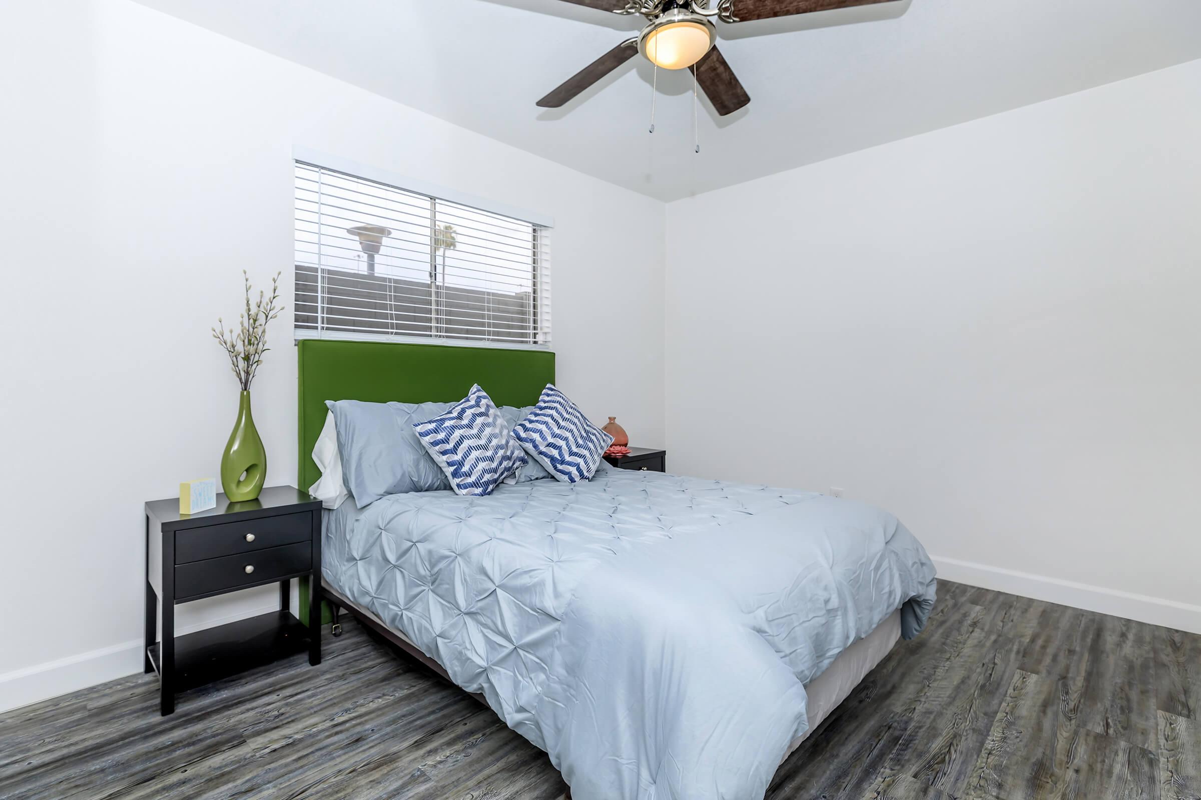 a bedroom with a large bed in a room