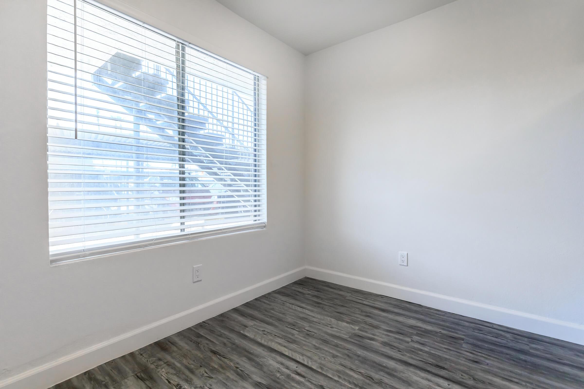 a bedroom with a large window